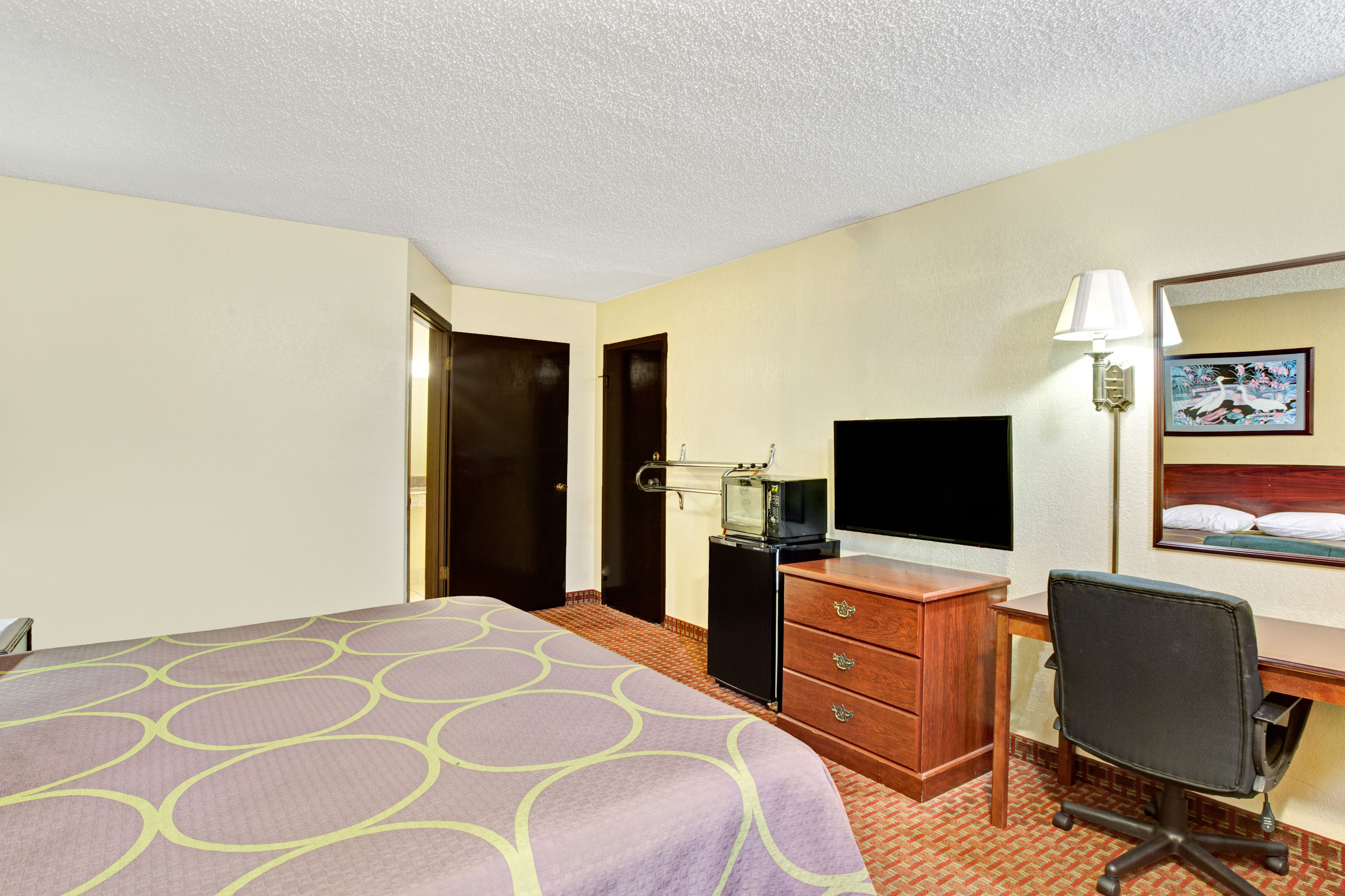 Guest room at the Super 8 by Wyndham Shawnee in Shawnee, Oklahoma