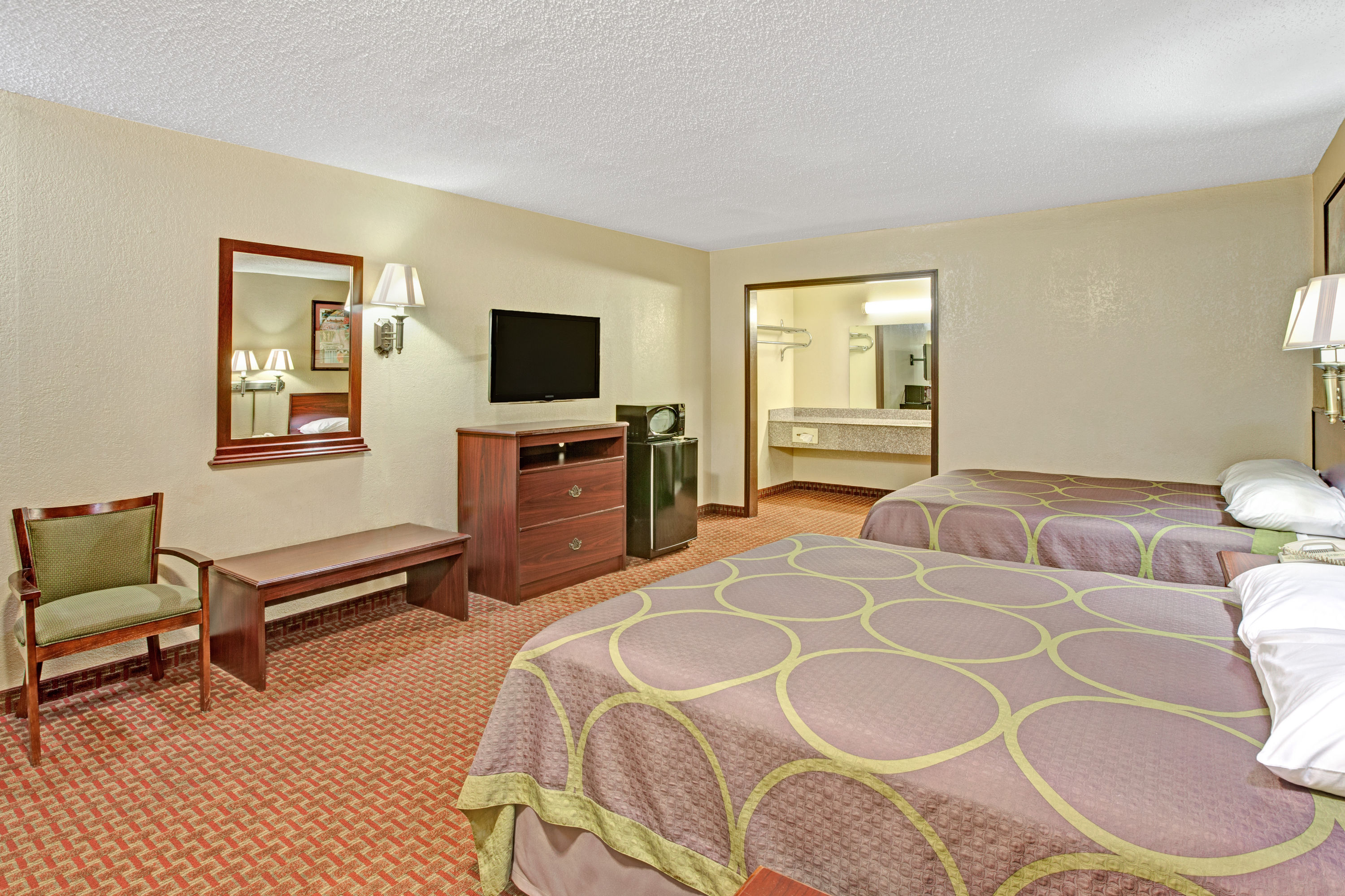 Guest room at the Super 8 by Wyndham Shawnee in Shawnee, Oklahoma