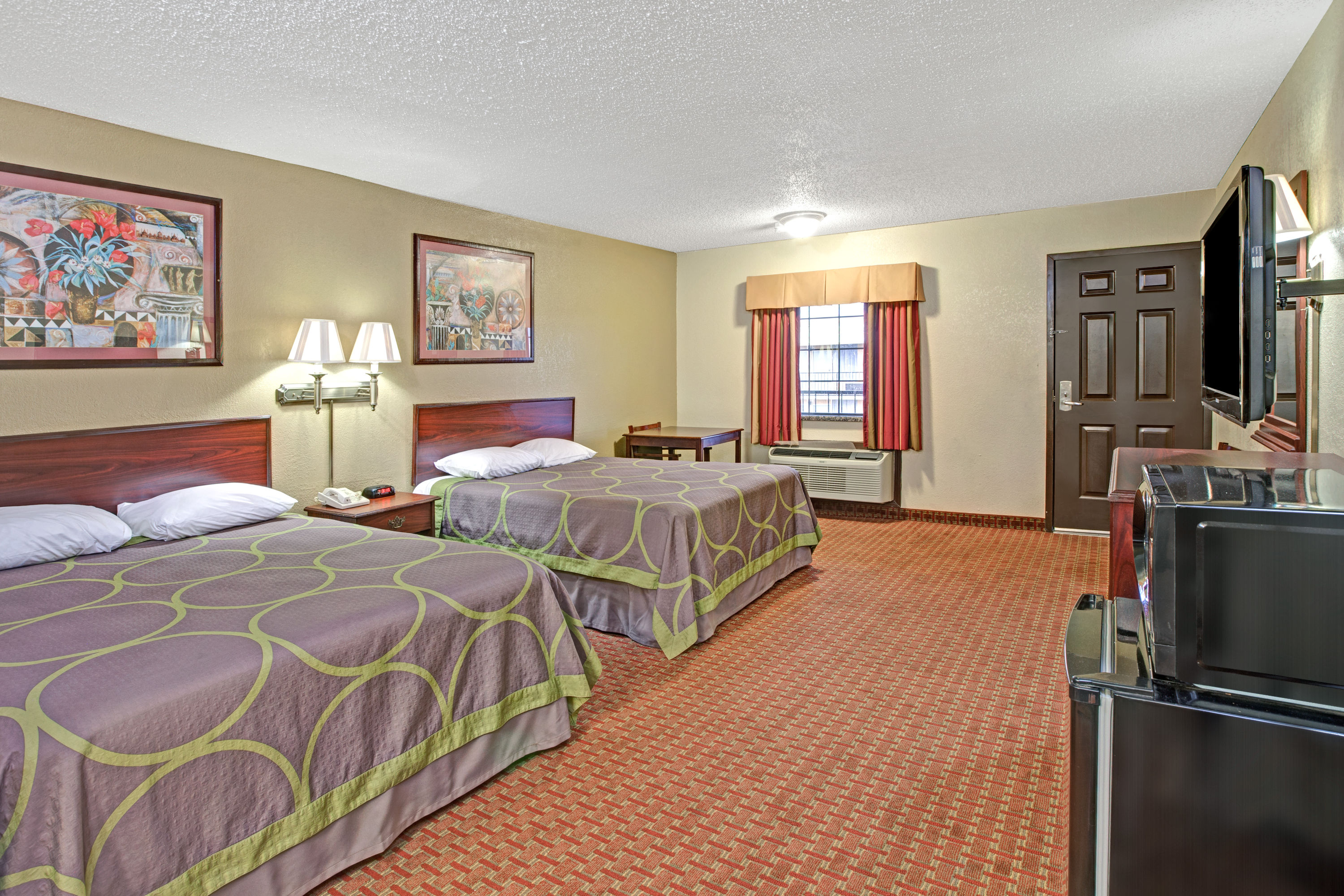 Guest room at the Super 8 by Wyndham Shawnee in Shawnee, Oklahoma