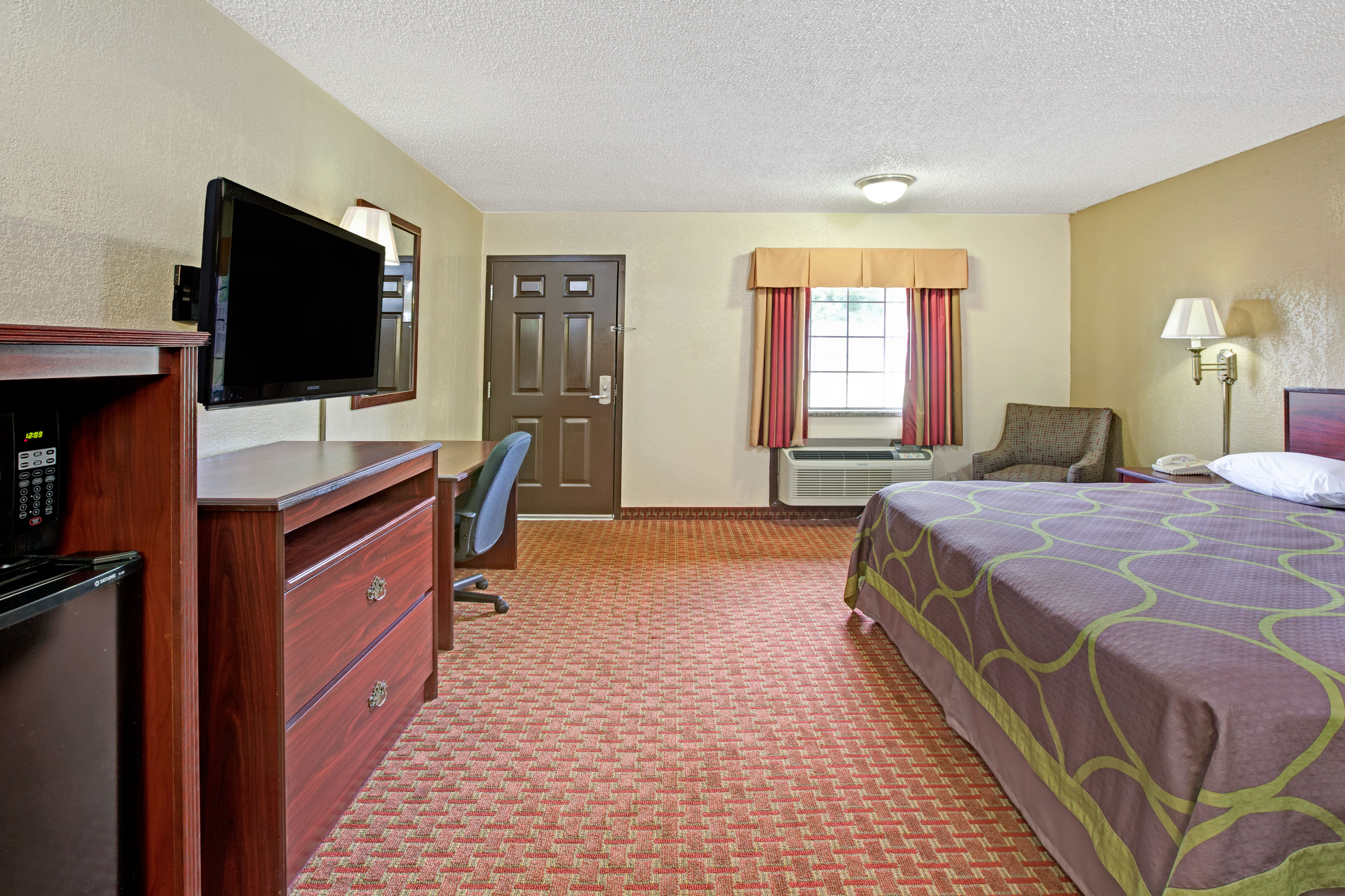 Guest room at the Super 8 by Wyndham Shawnee in Shawnee, Oklahoma