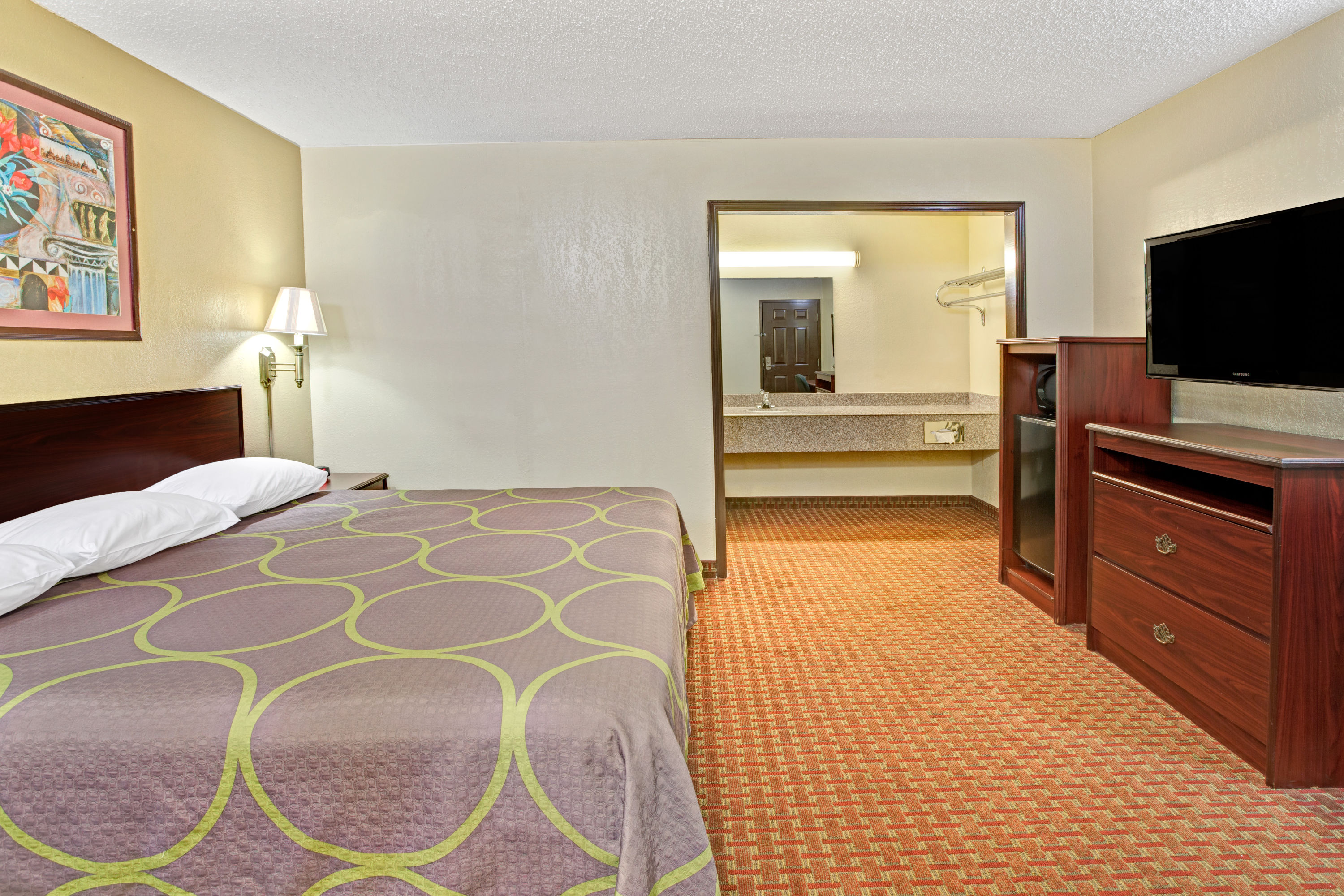Guest room at the Super 8 by Wyndham Shawnee in Shawnee, Oklahoma
