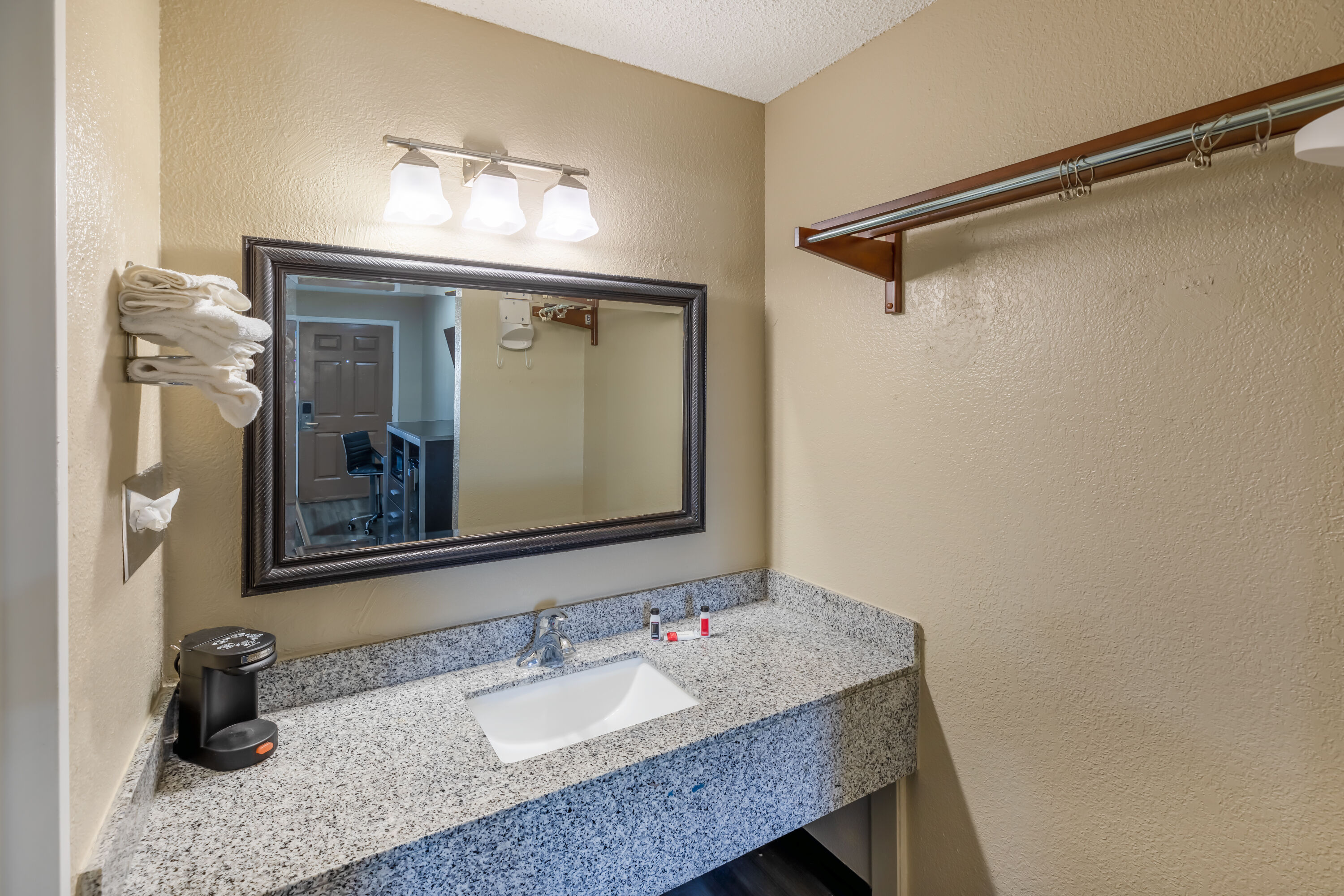 Guest room bath at the Super 8 by Wyndham Tulsa/Arpt/St Fairgrounds in Tulsa, Oklahoma