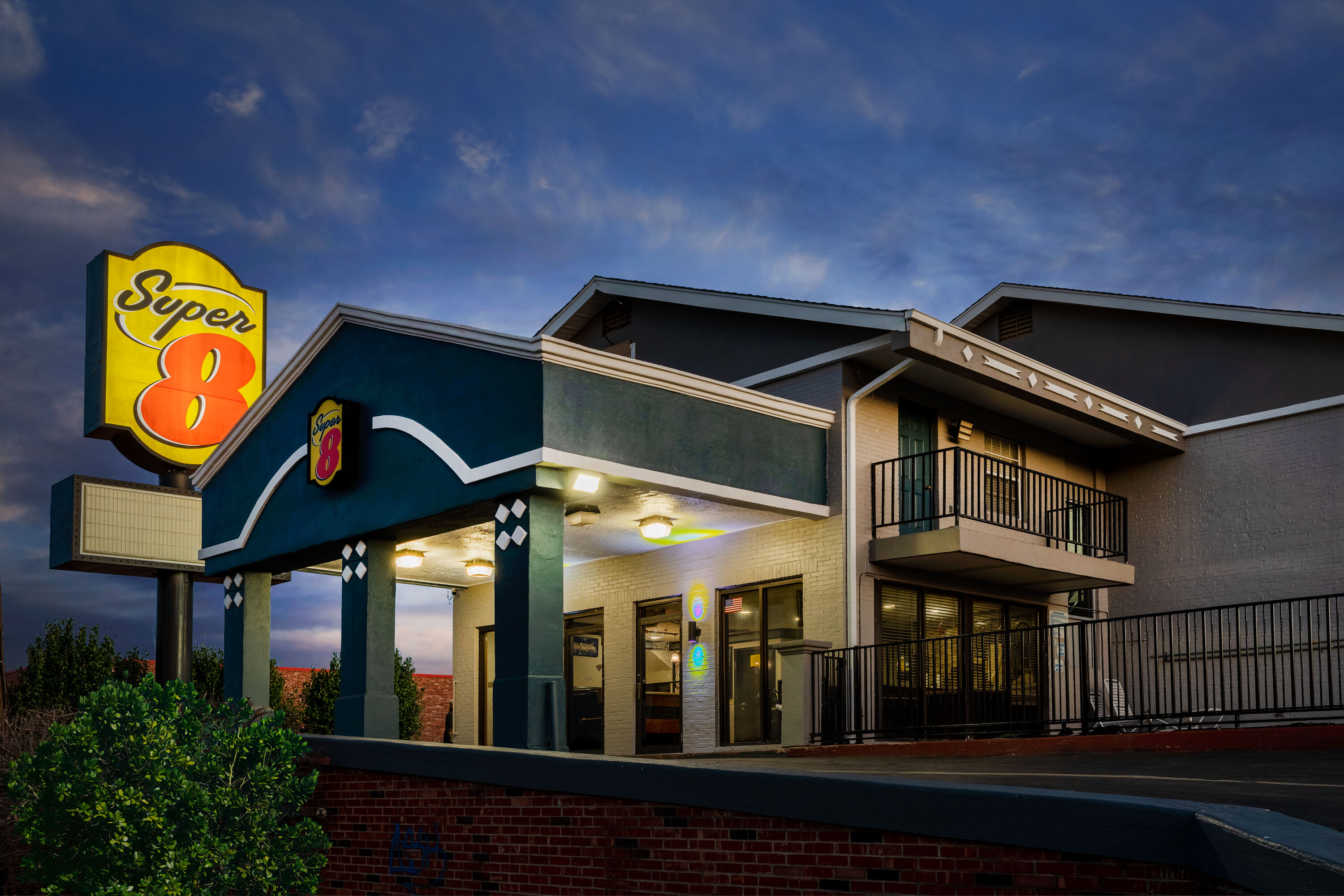 Exterior Dusk Image of Super 8 by Wyndham Tulsa/Arpt/St Fairgrounds hotel in Tulsa, Oklahoma
