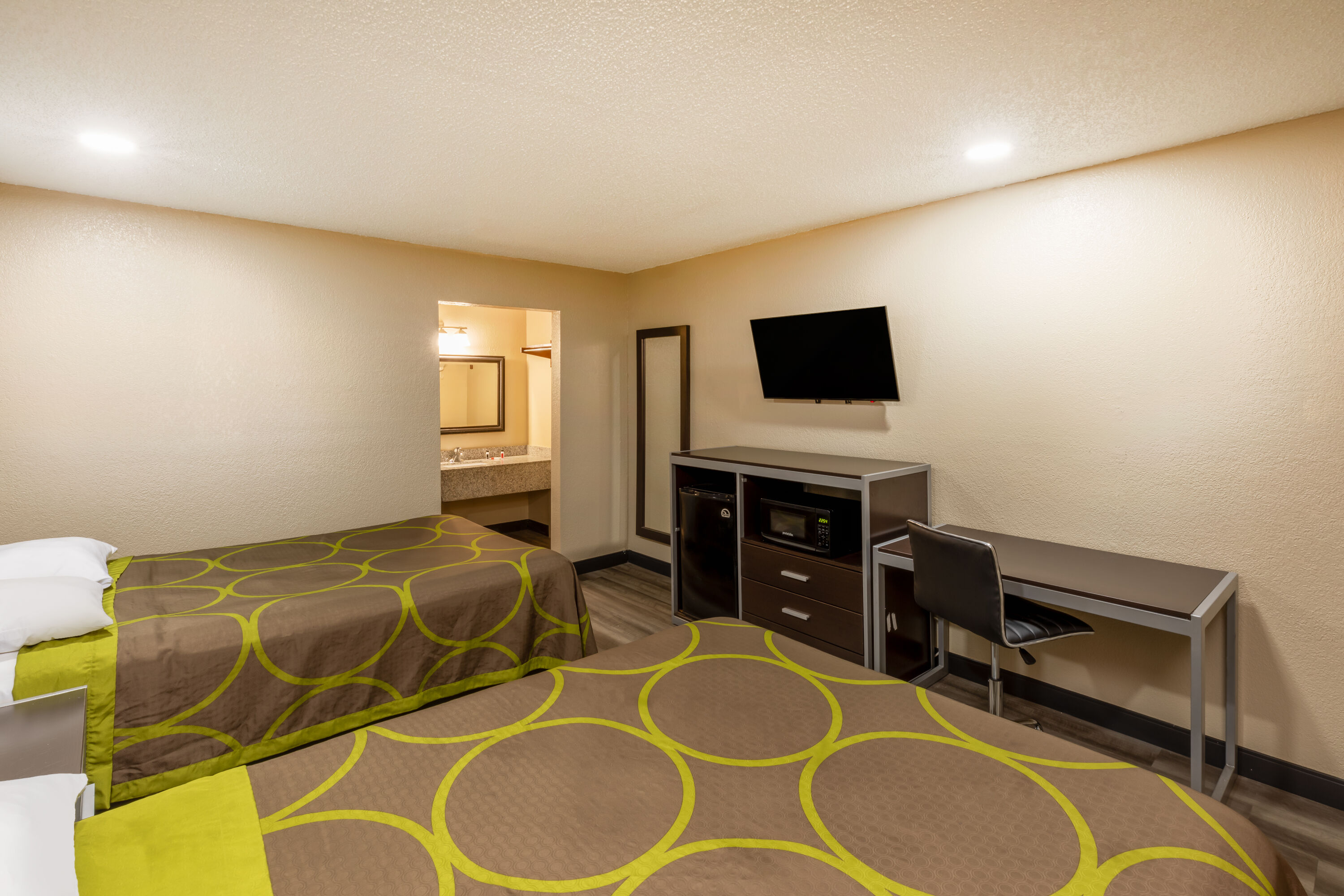 Guest room at the Super 8 by Wyndham Tulsa/Arpt/St Fairgrounds in Tulsa, Oklahoma