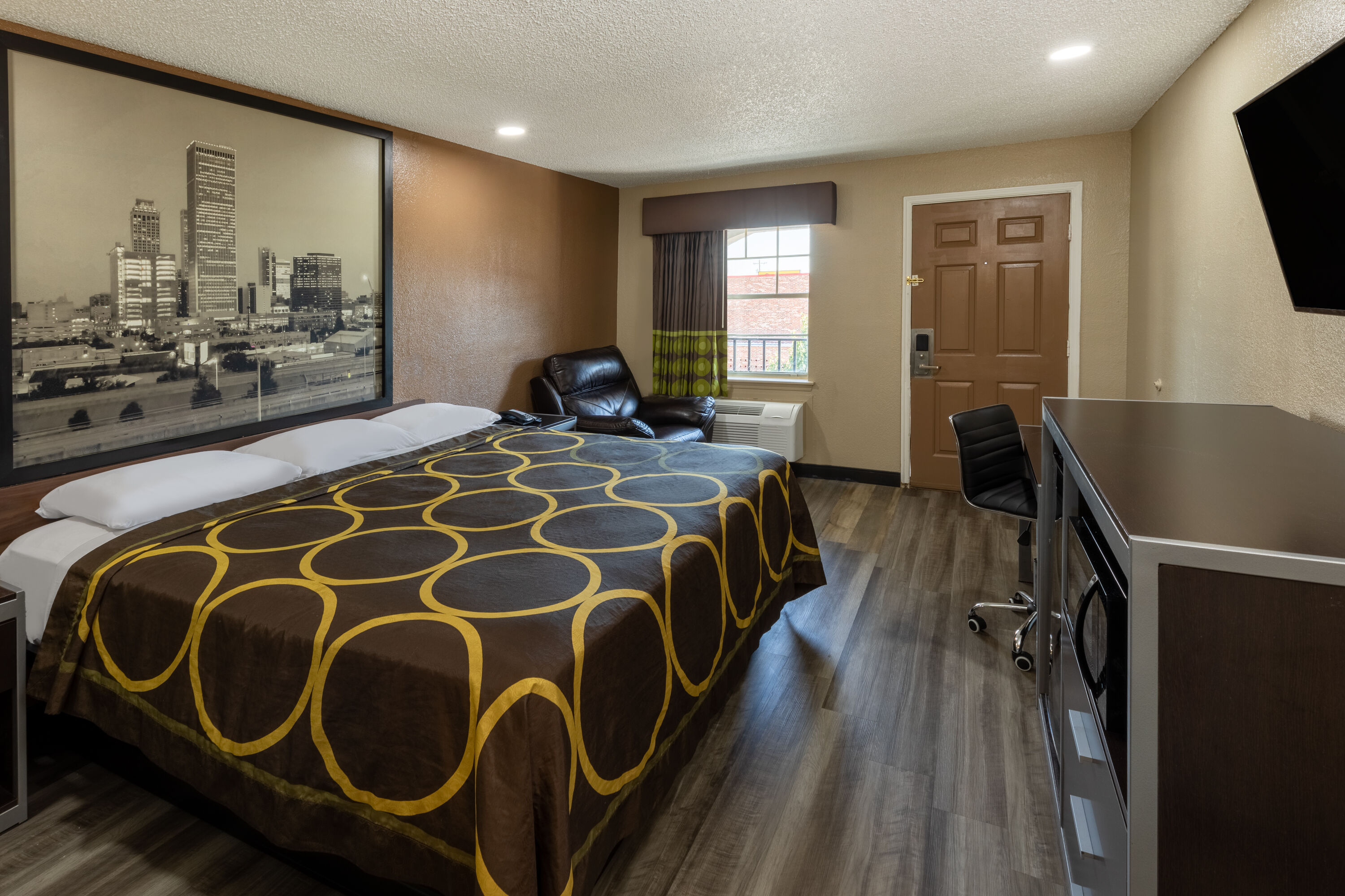 Guest room at the Super 8 by Wyndham Tulsa/Arpt/St Fairgrounds in Tulsa, Oklahoma