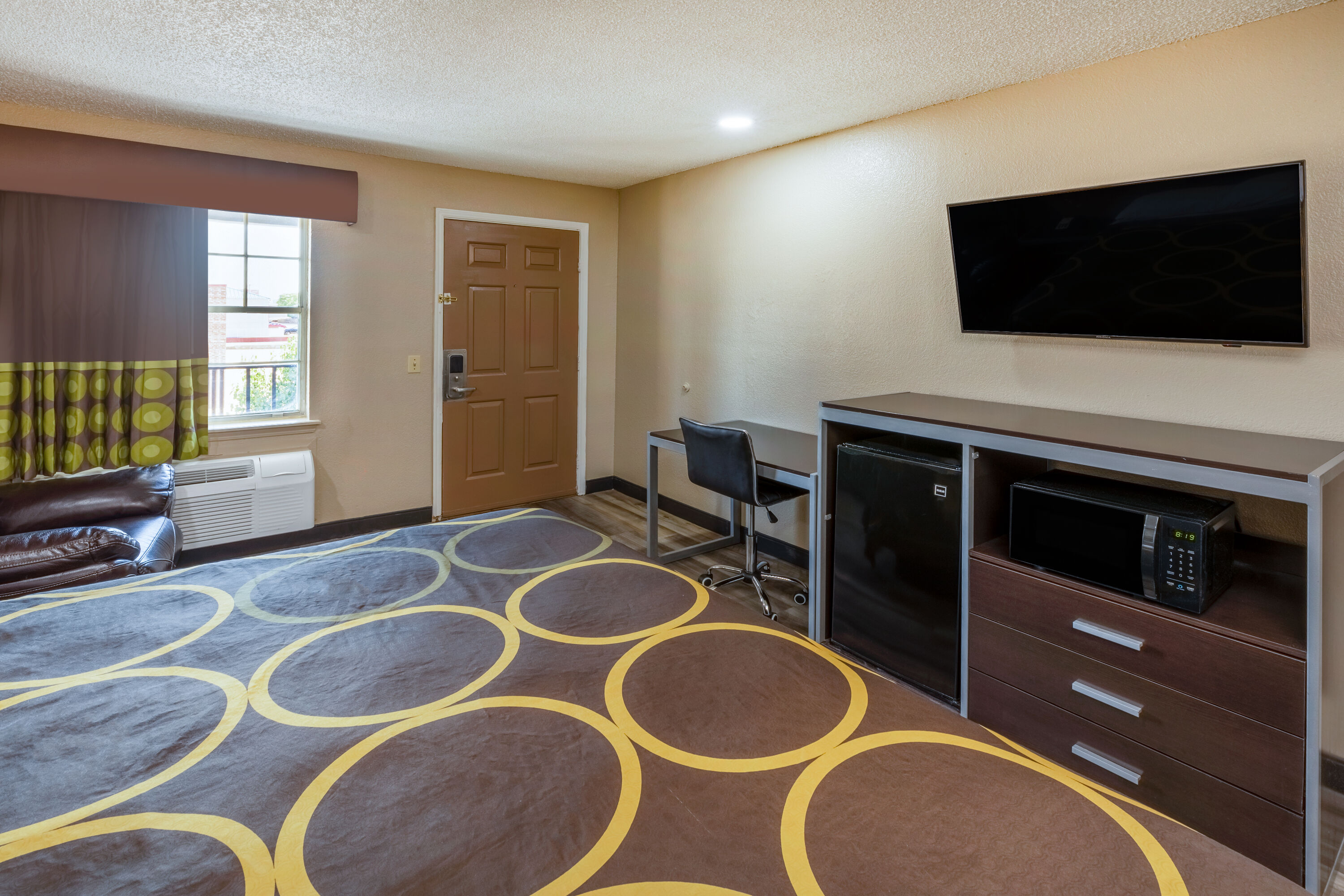 Guest room at the Super 8 by Wyndham Tulsa/Arpt/St Fairgrounds in Tulsa, Oklahoma