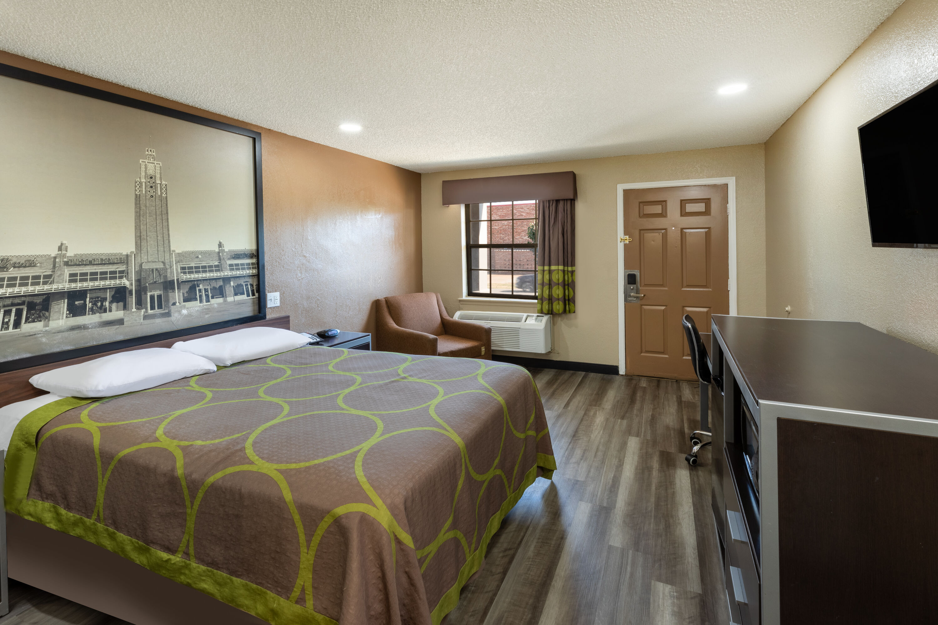 Guest room at the Super 8 by Wyndham Tulsa/Arpt/St Fairgrounds in Tulsa, Oklahoma
