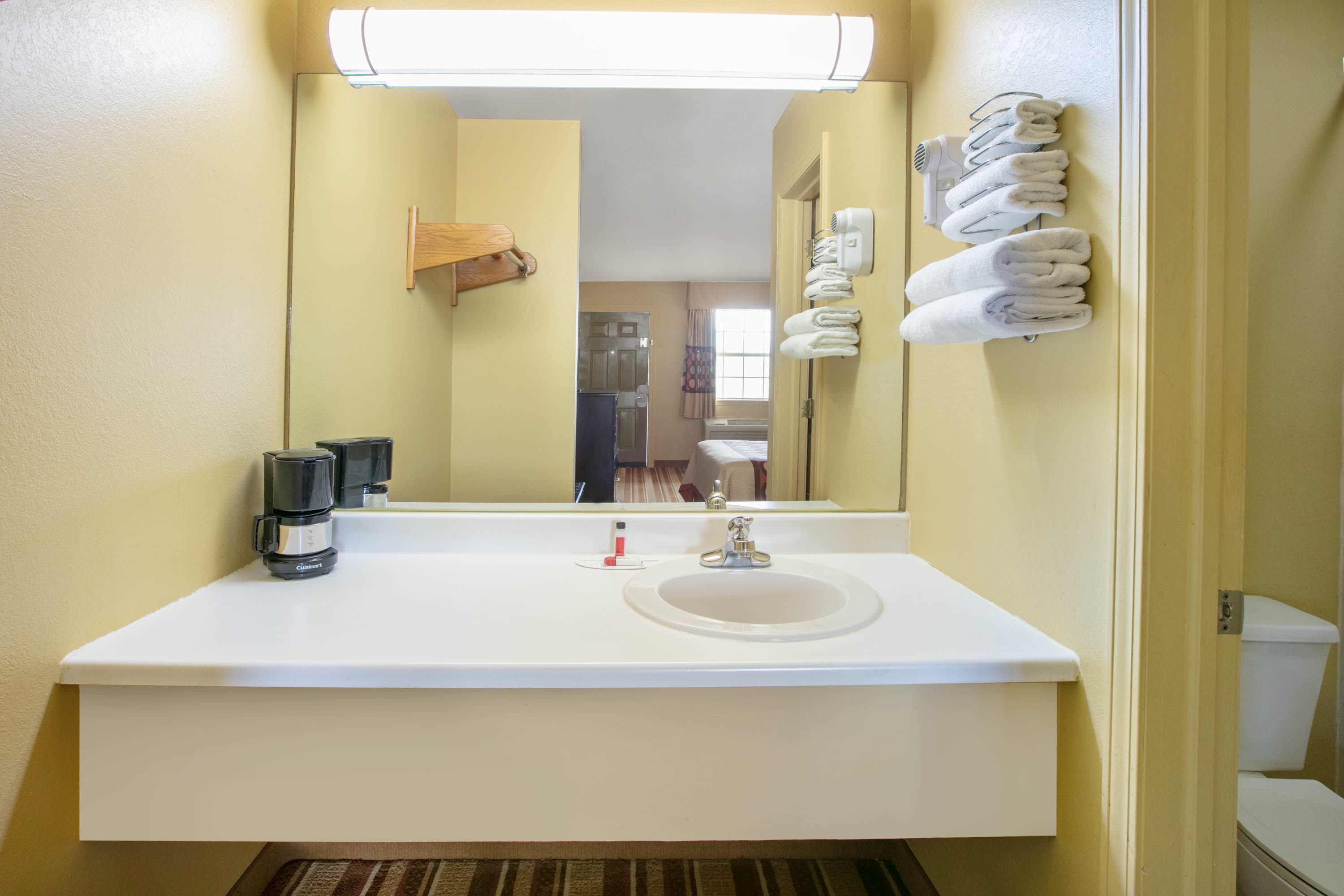Guest room bath at the Super 8 by Wyndham Big Cabin/Vinita Area in Vinita, Oklahoma
