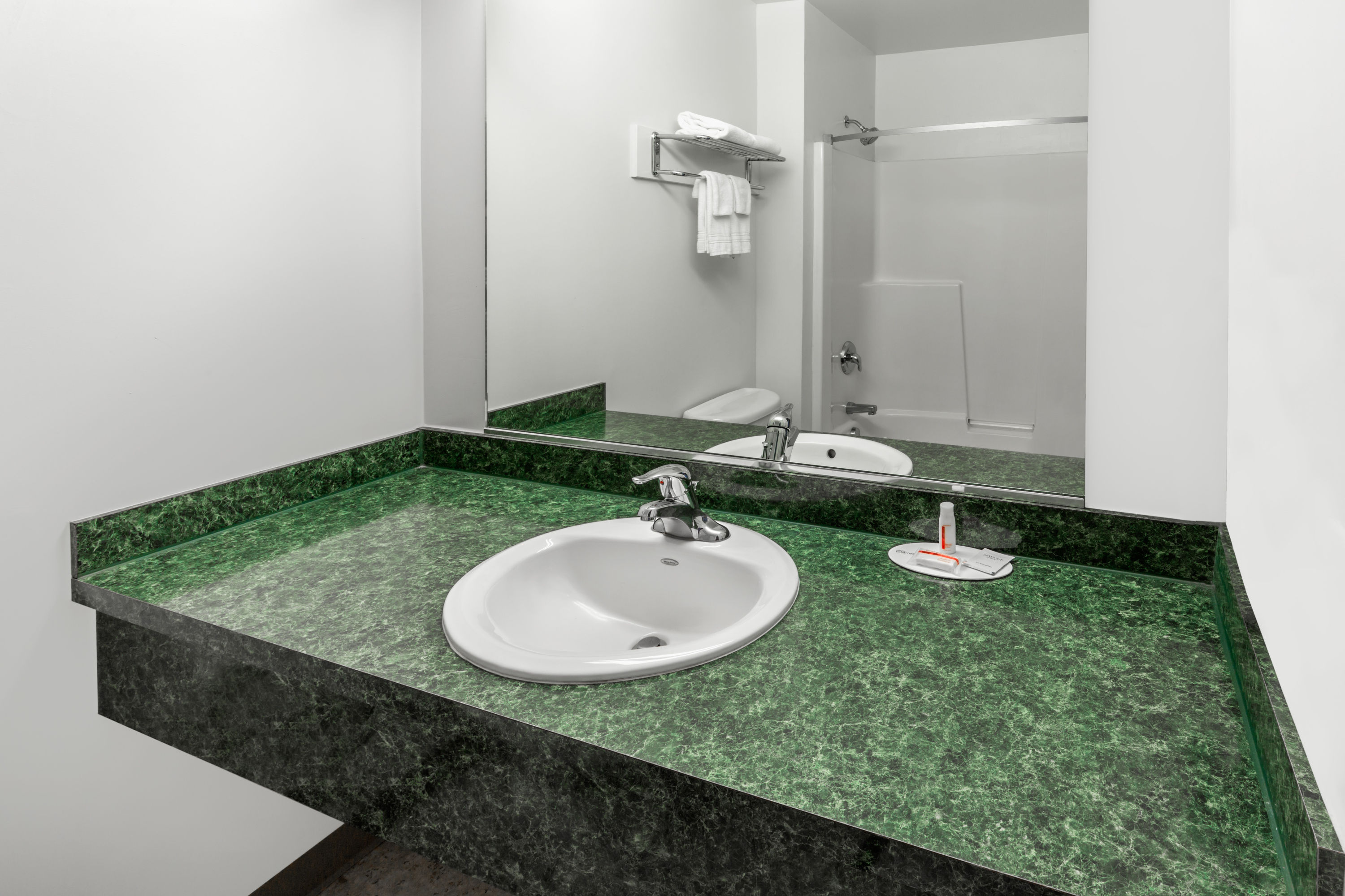 Guest room bath at the Super 8 by Wyndham Central Pt Medford in Medford, Oregon