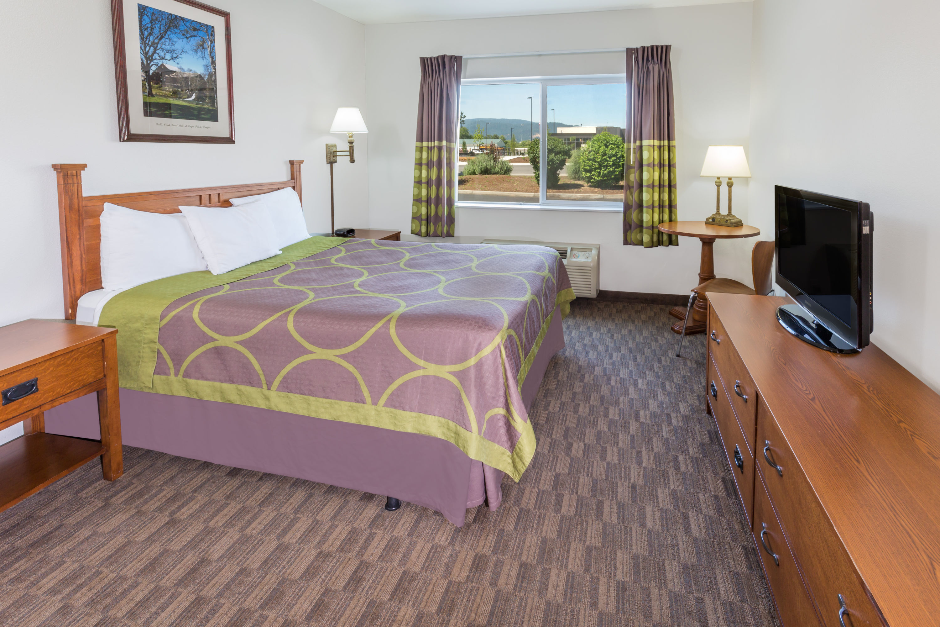 Guest room at the Super 8 by Wyndham Central Pt Medford in Medford, Oregon