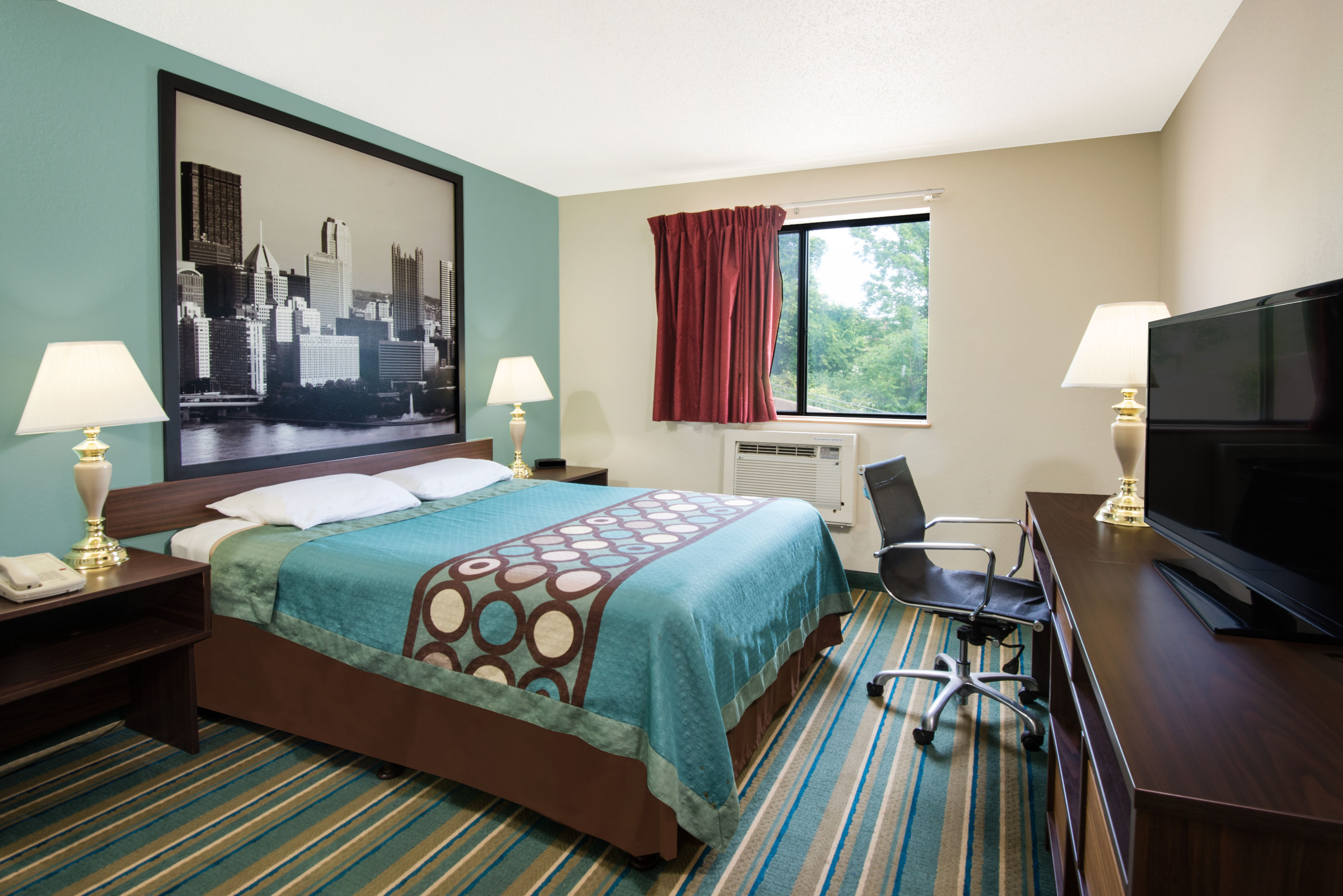 Guest room at the Super 8 by Wyndham Pittsburgh PA Airport/University Area in Coraopolis, Pennsylvania