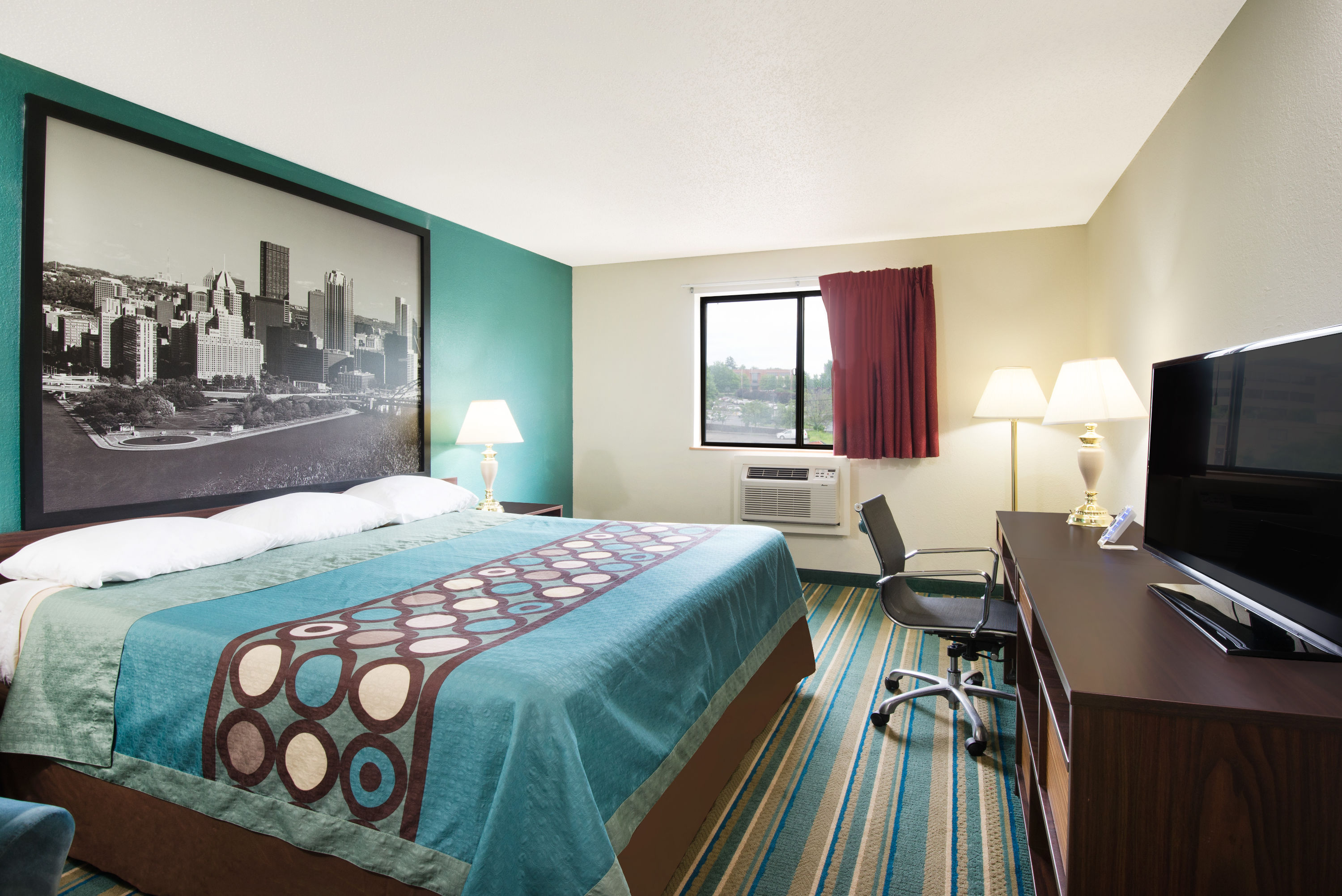 Guest room at the Super 8 by Wyndham Pittsburgh PA Airport/University Area in Coraopolis, Pennsylvania
