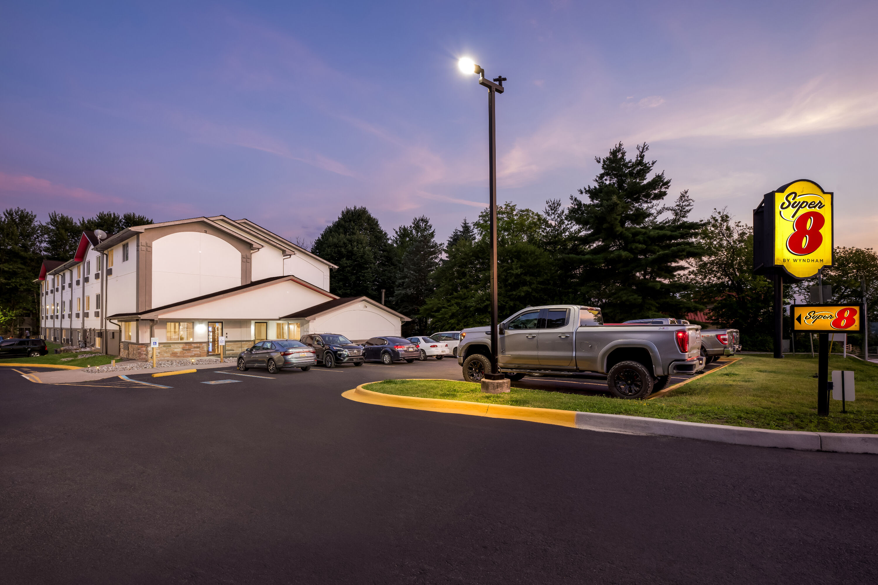 Exterior Night Image of Super 8 by Wyndham East Stroudsburg/Poconos hotel in East Stroudsburg, Pennsylvania