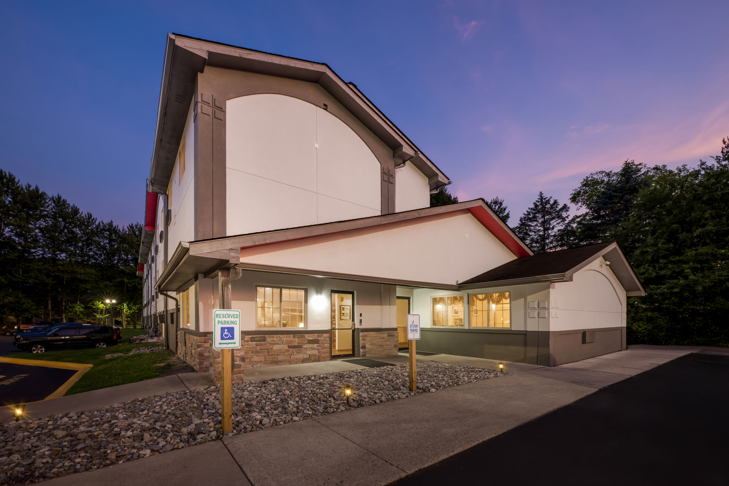 Exterior Night Image of Super 8 by Wyndham East Stroudsburg/Poconos hotel in East Stroudsburg, Pennsylvania