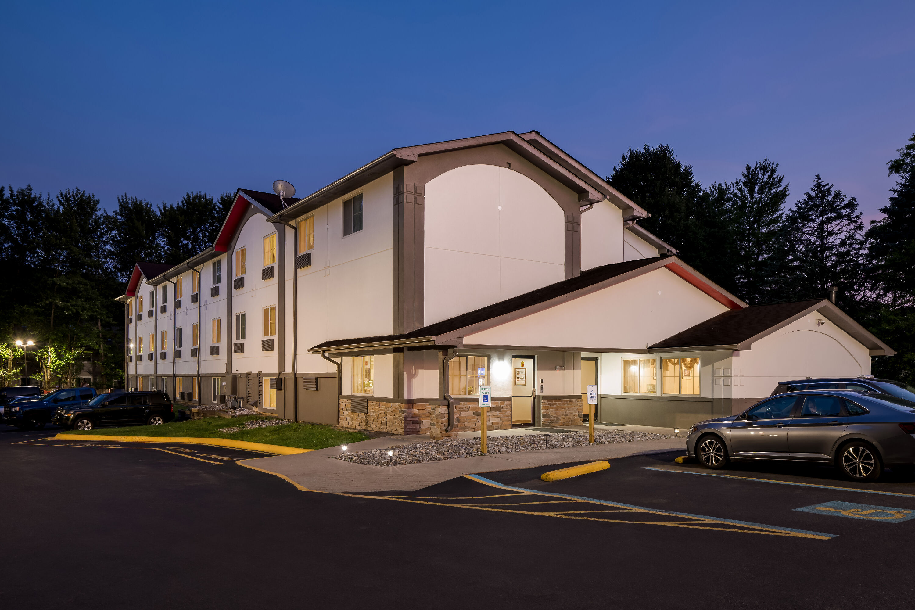 Exterior Night Image of Super 8 by Wyndham East Stroudsburg/Poconos hotel in East Stroudsburg, Pennsylvania