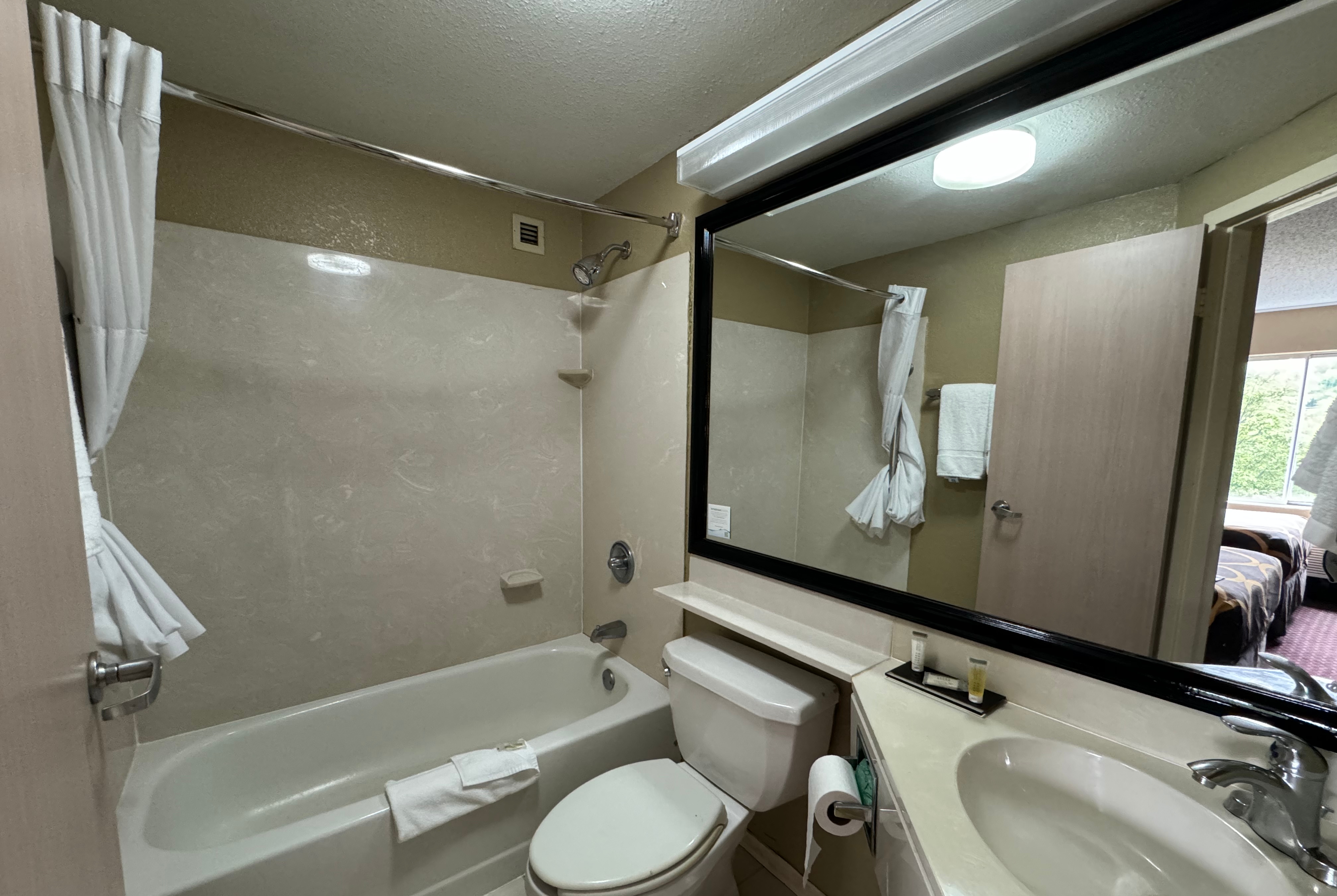 Guest room bath at the Super 8 by Wyndham New Cumberland in New Cumberland, Pennsylvania