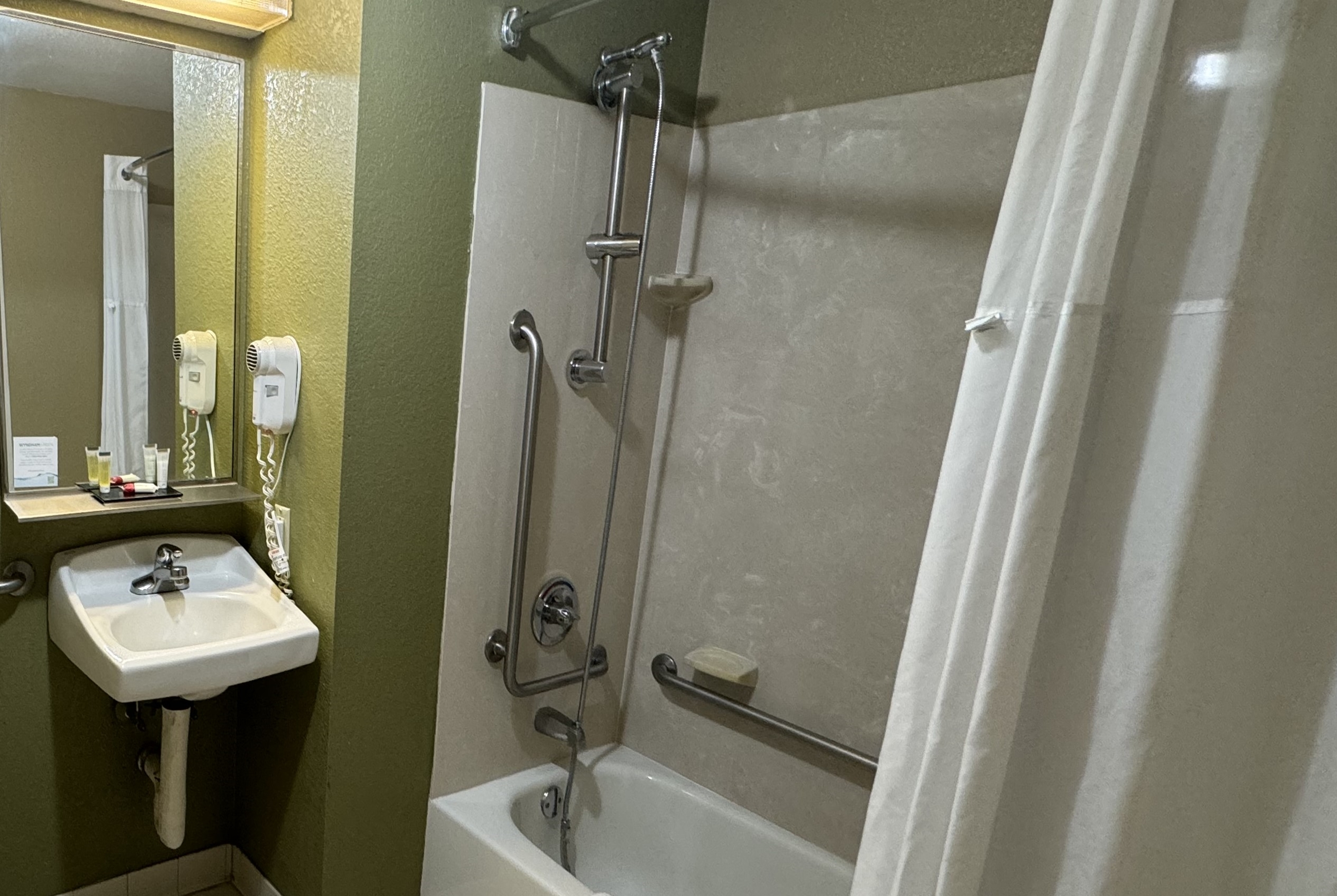 Guest room bath at the Super 8 by Wyndham New Cumberland in New Cumberland, Pennsylvania