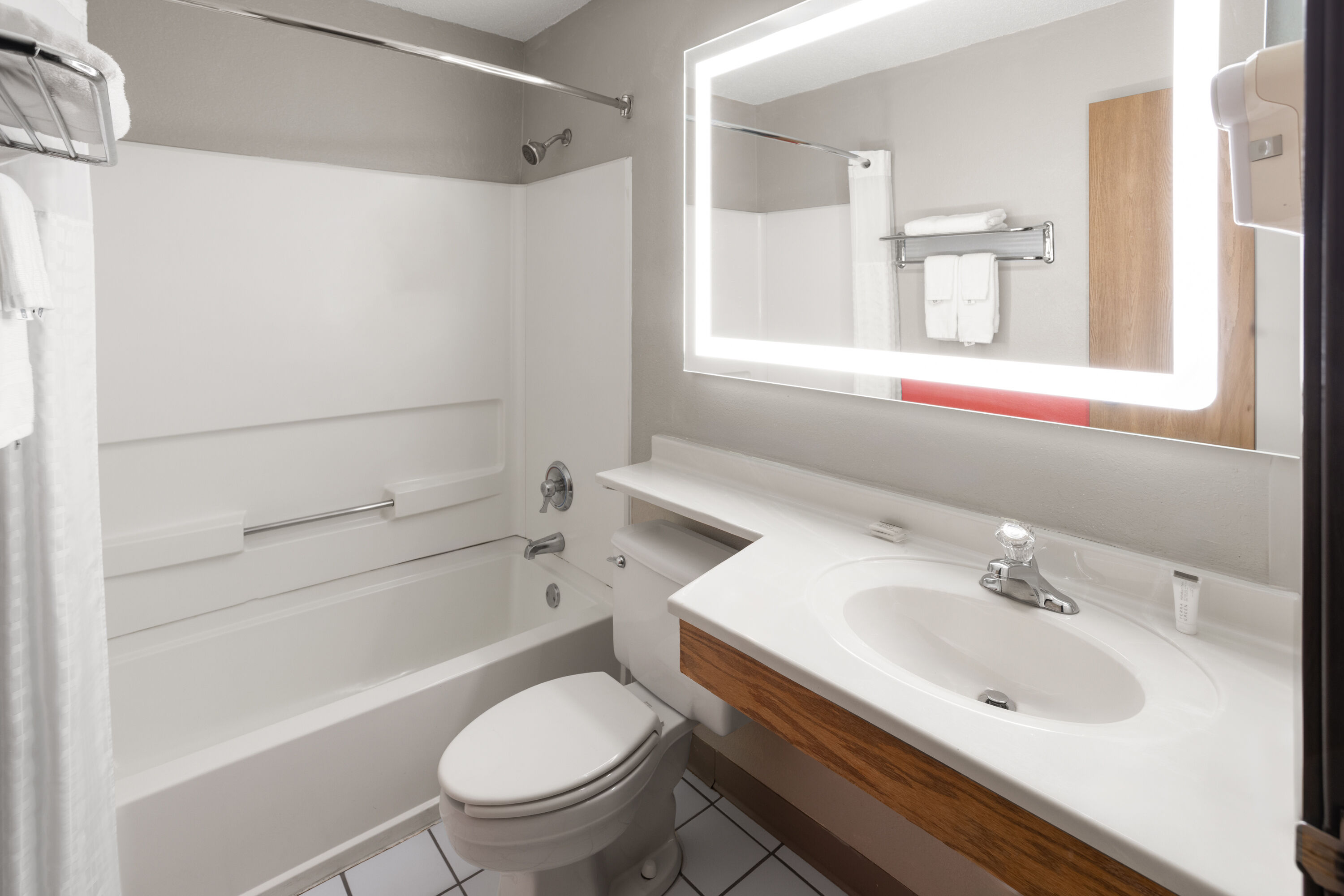 Guest room bath at the Super 8 by Wyndham New Stanton in New Stanton, Pennsylvania