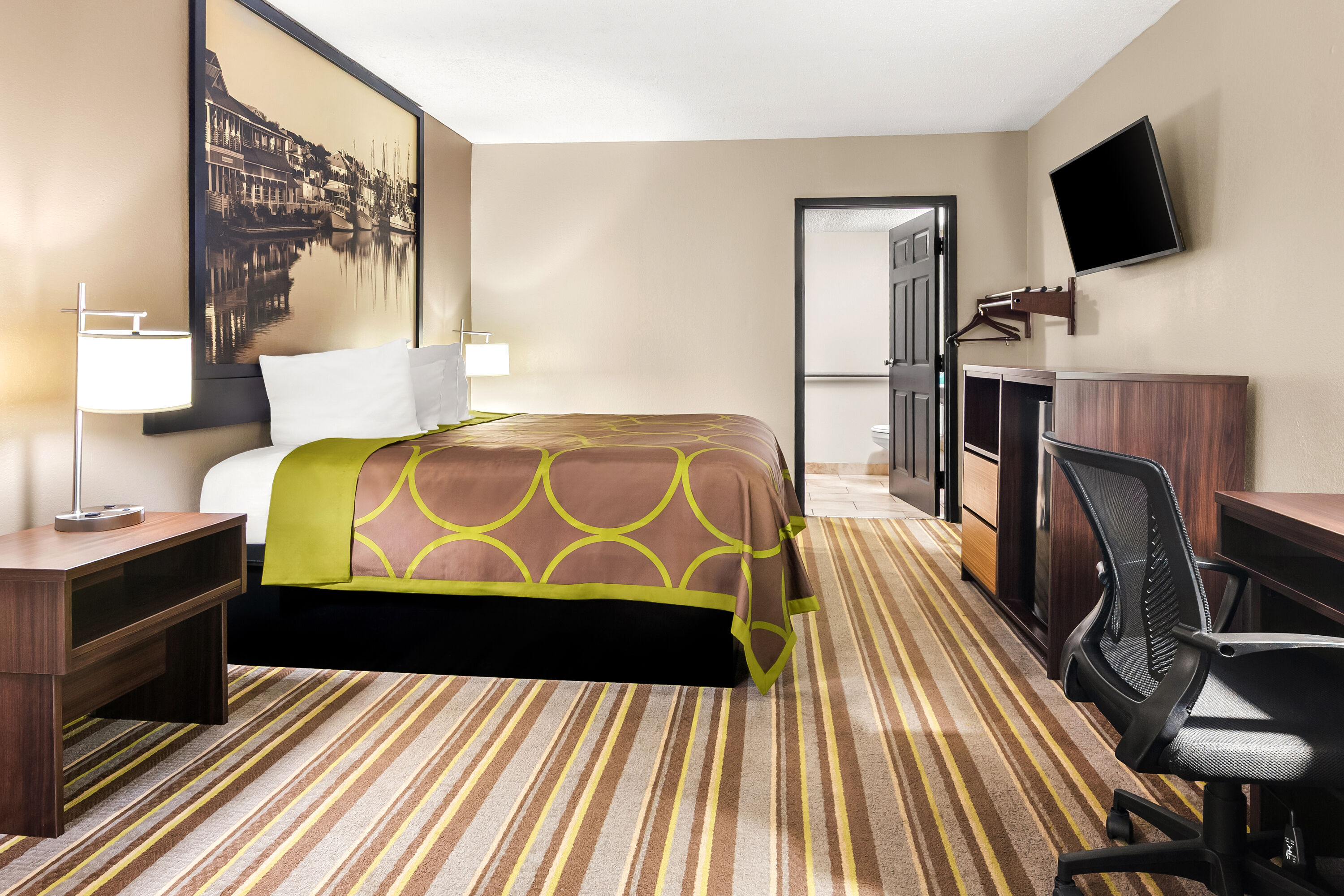 King bed guest room at the Super 8 by Wyndham Columbia in Columbia, South Carolina