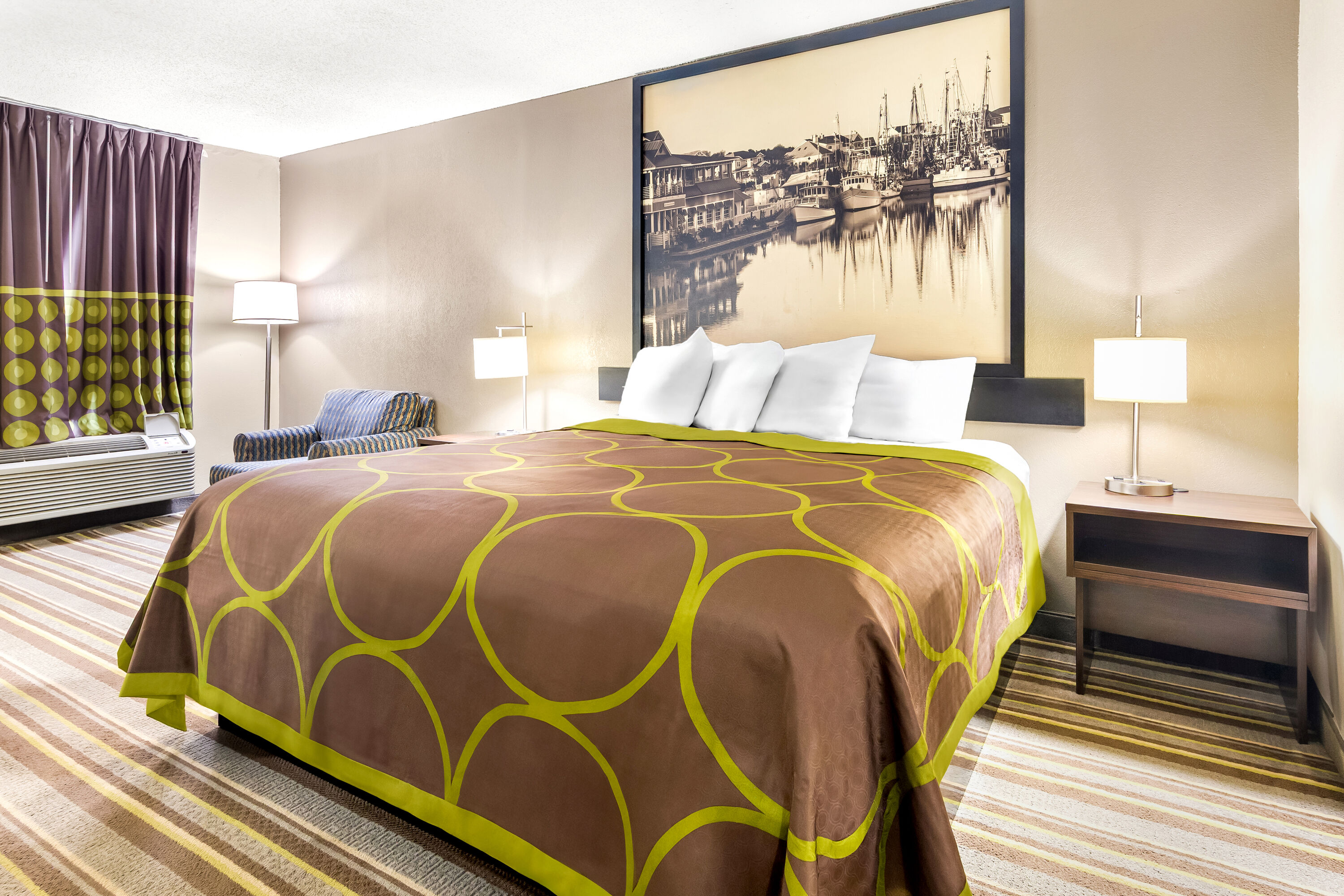 King bed guest room at the Super 8 by Wyndham Columbia in Columbia, South Carolina