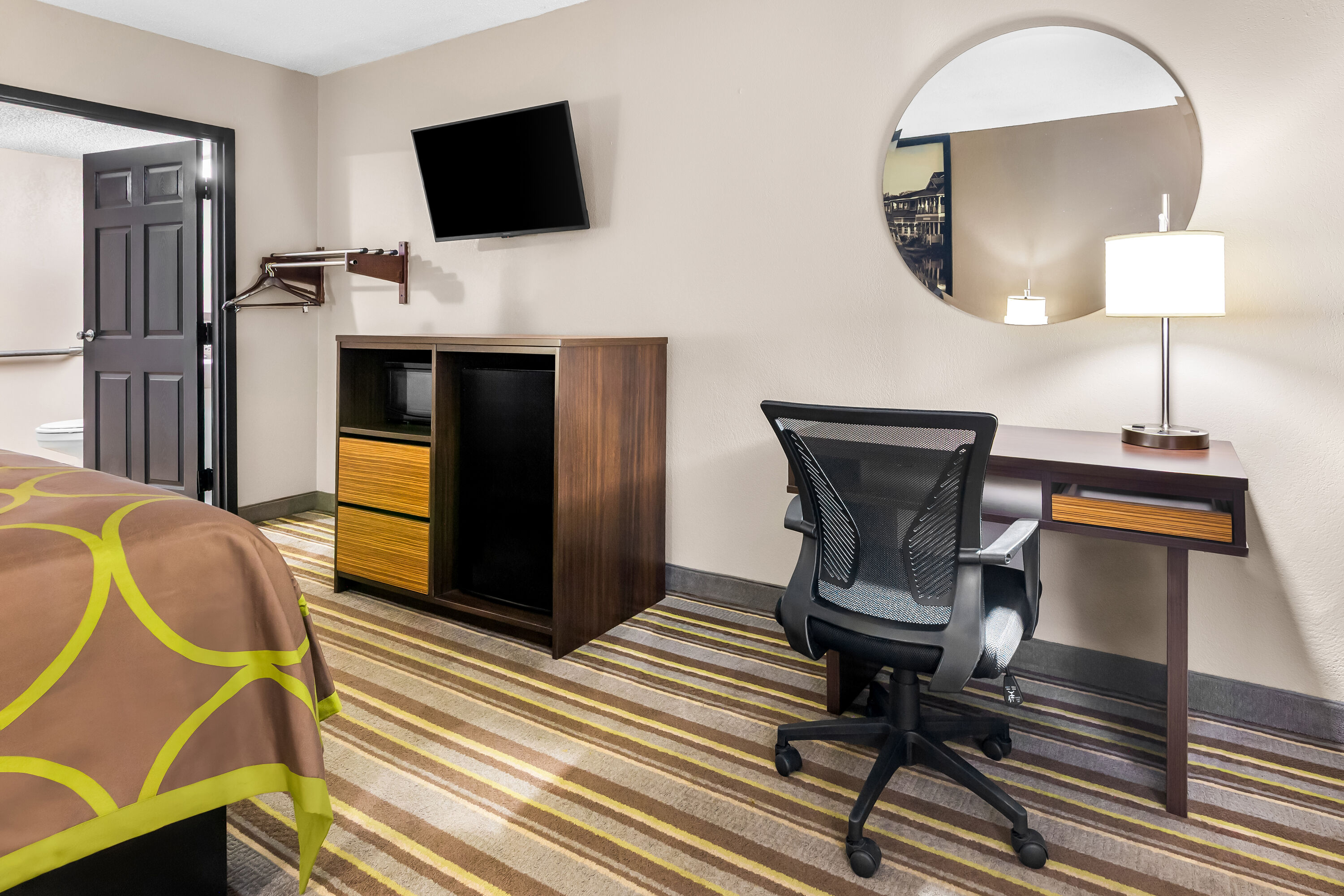 King bed guest room at the Super 8 by Wyndham Columbia in Columbia, South Carolina