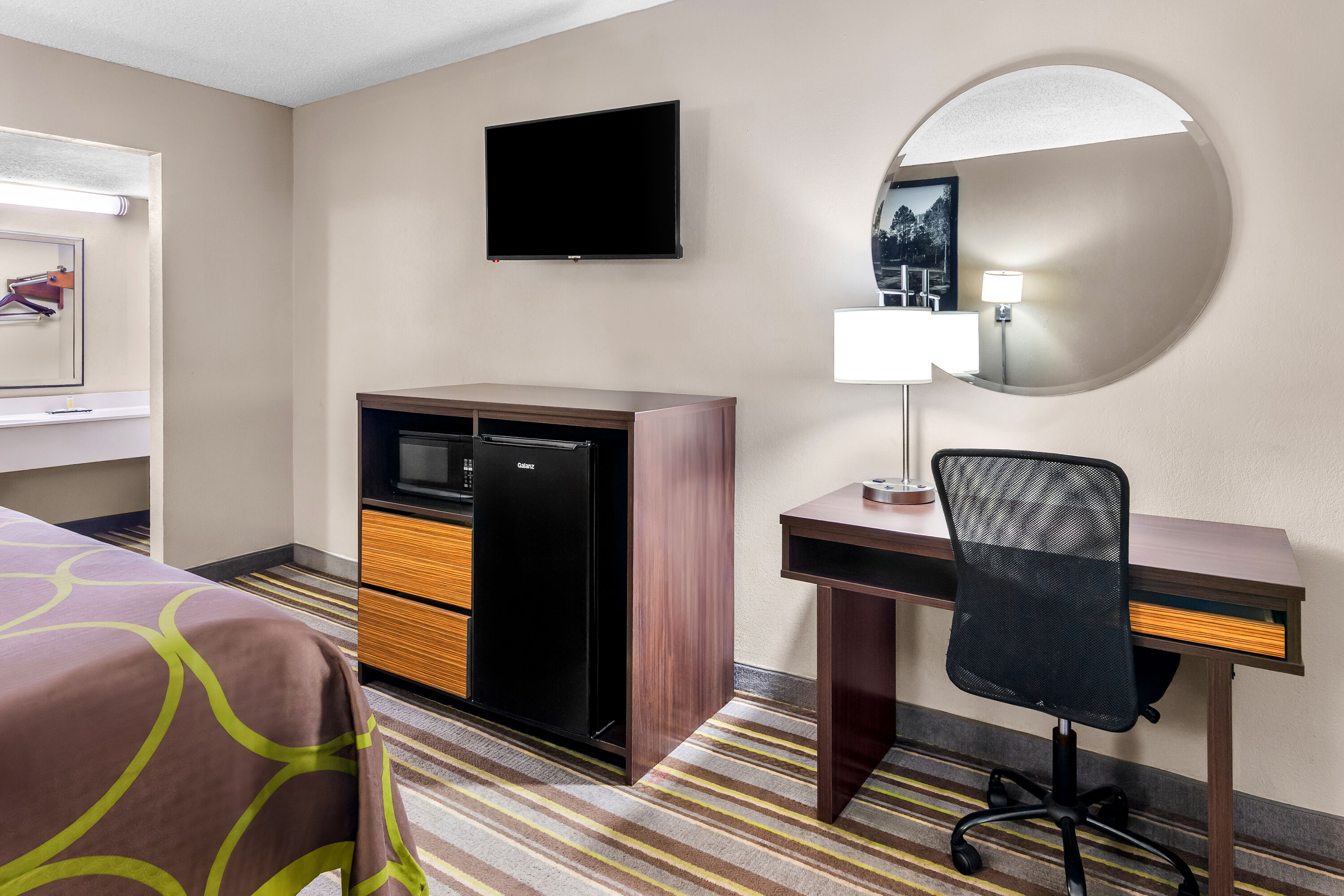 King bed guest room at the Super 8 by Wyndham Columbia in Columbia, South Carolina