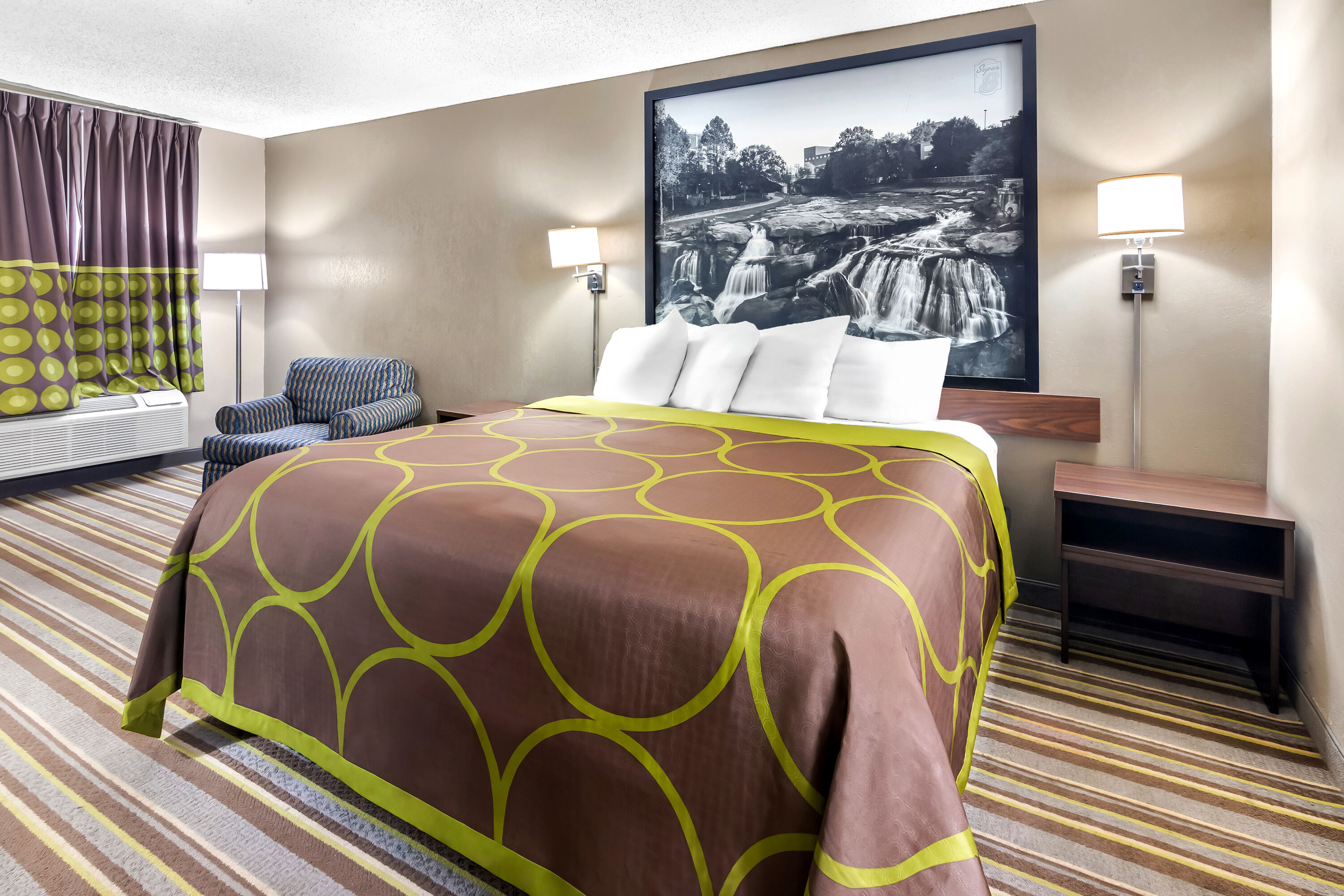 King bed guest room at the Super 8 by Wyndham Columbia in Columbia, South Carolina