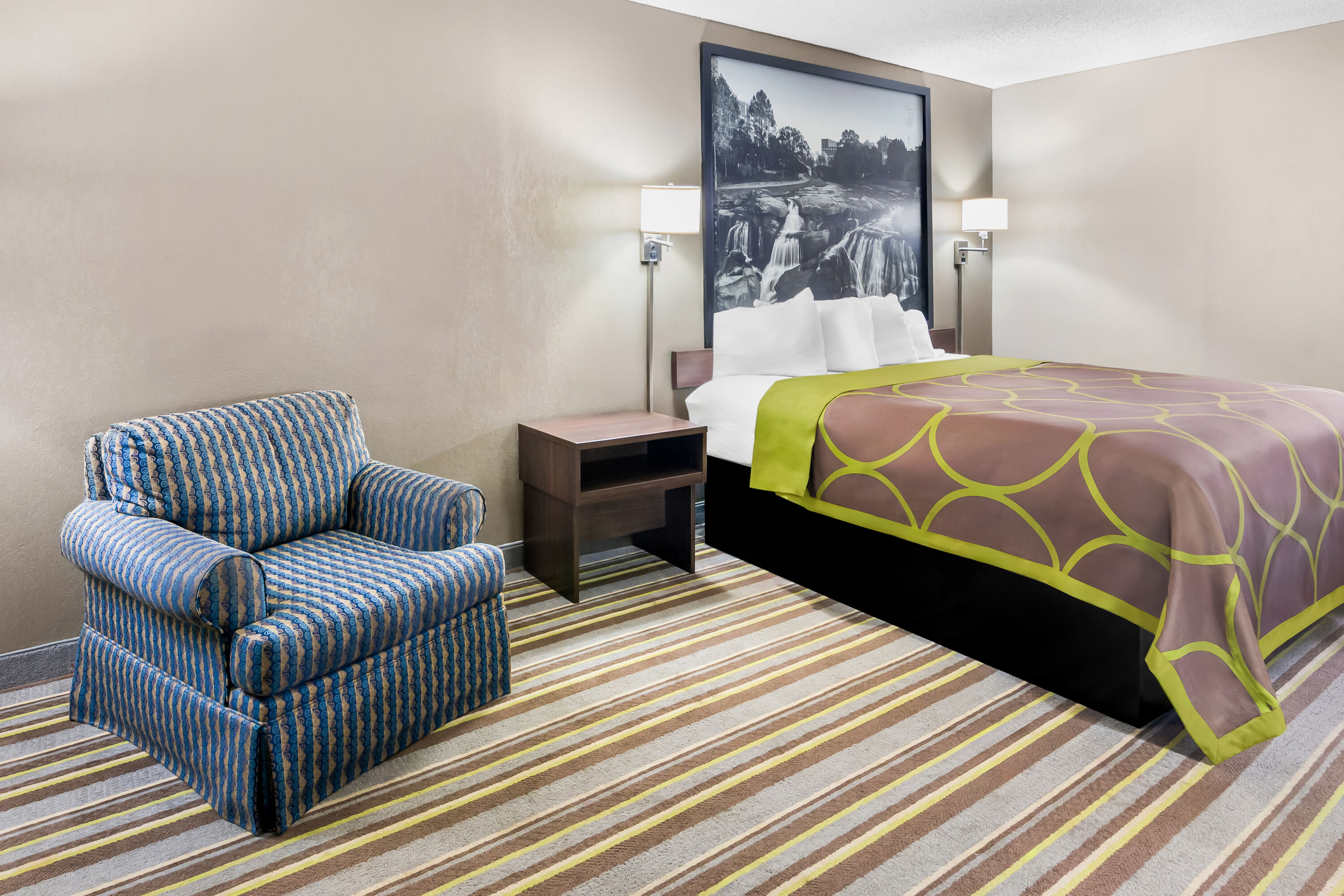 King bed guest room at the Super 8 by Wyndham Columbia in Columbia, South Carolina