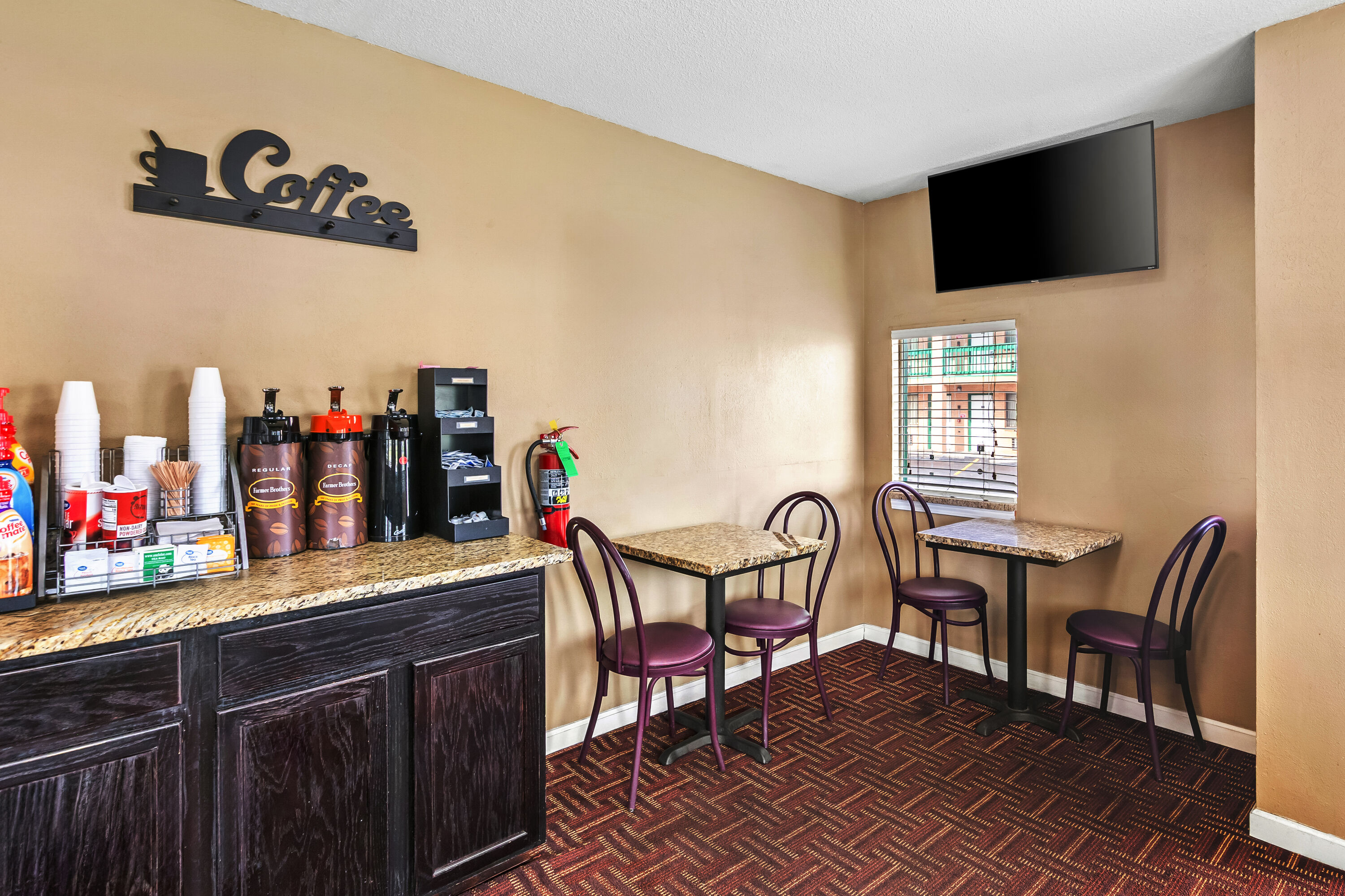 Super 8 by Wyndham Columbia SC / Ft. Jackson restaurant breakfast area with seating in Columbia, South Carolina