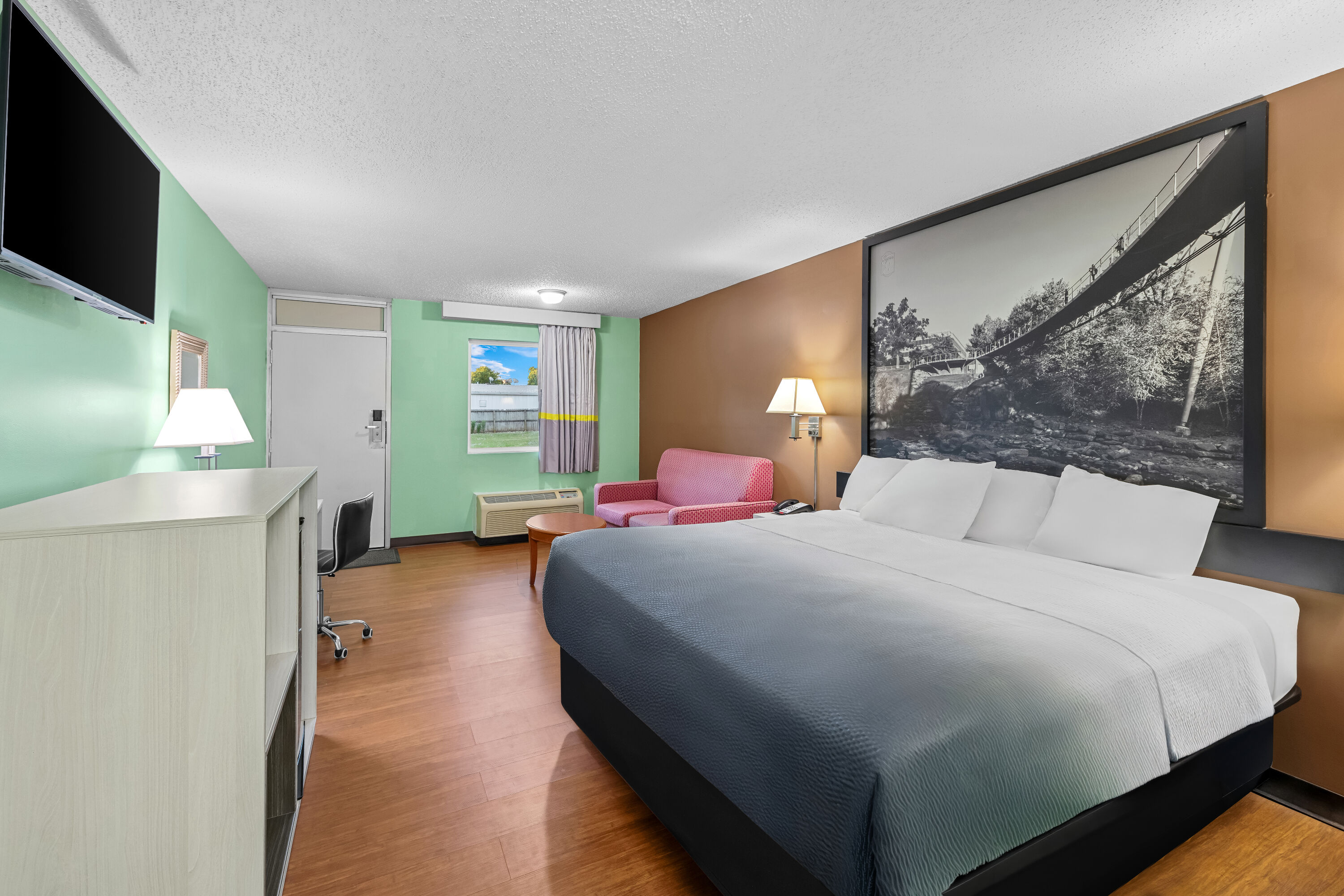 King bed guest room at the Super 8 by Wyndham Gaffney in Gaffney, South Carolina