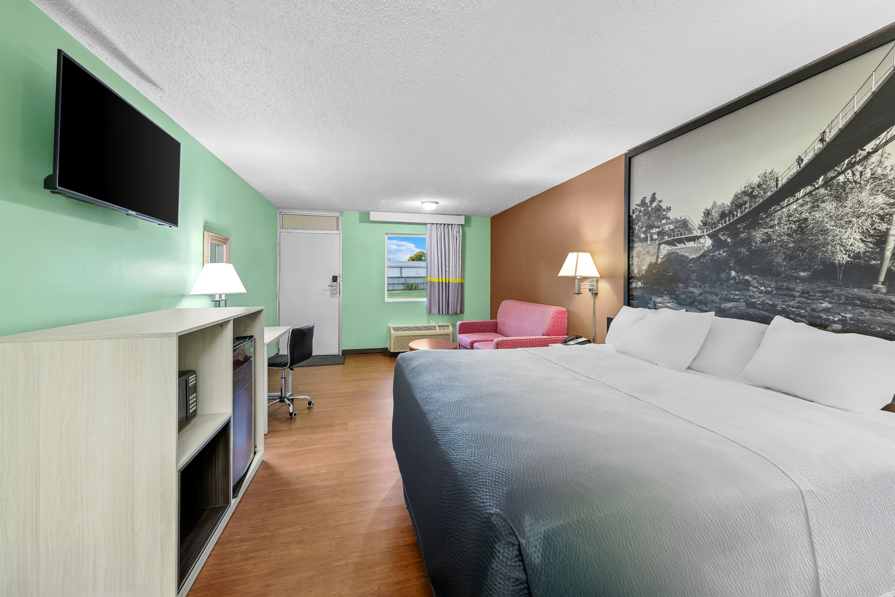 King bed guest room at the Super 8 by Wyndham Gaffney in Gaffney, South Carolina