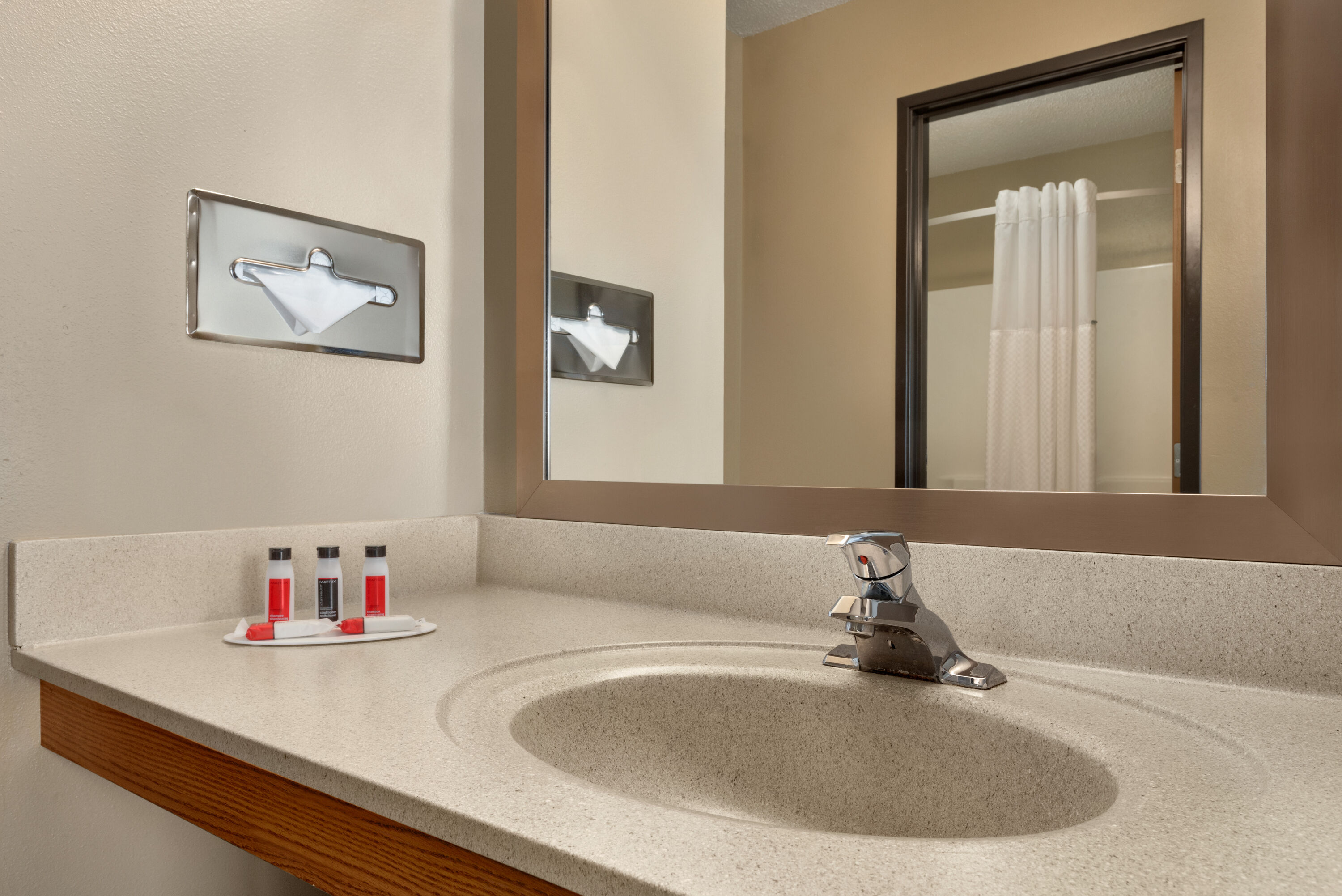 Guest room bath at the Super 8 by Wyndham Sioux Falls in Sioux Falls, South Dakota