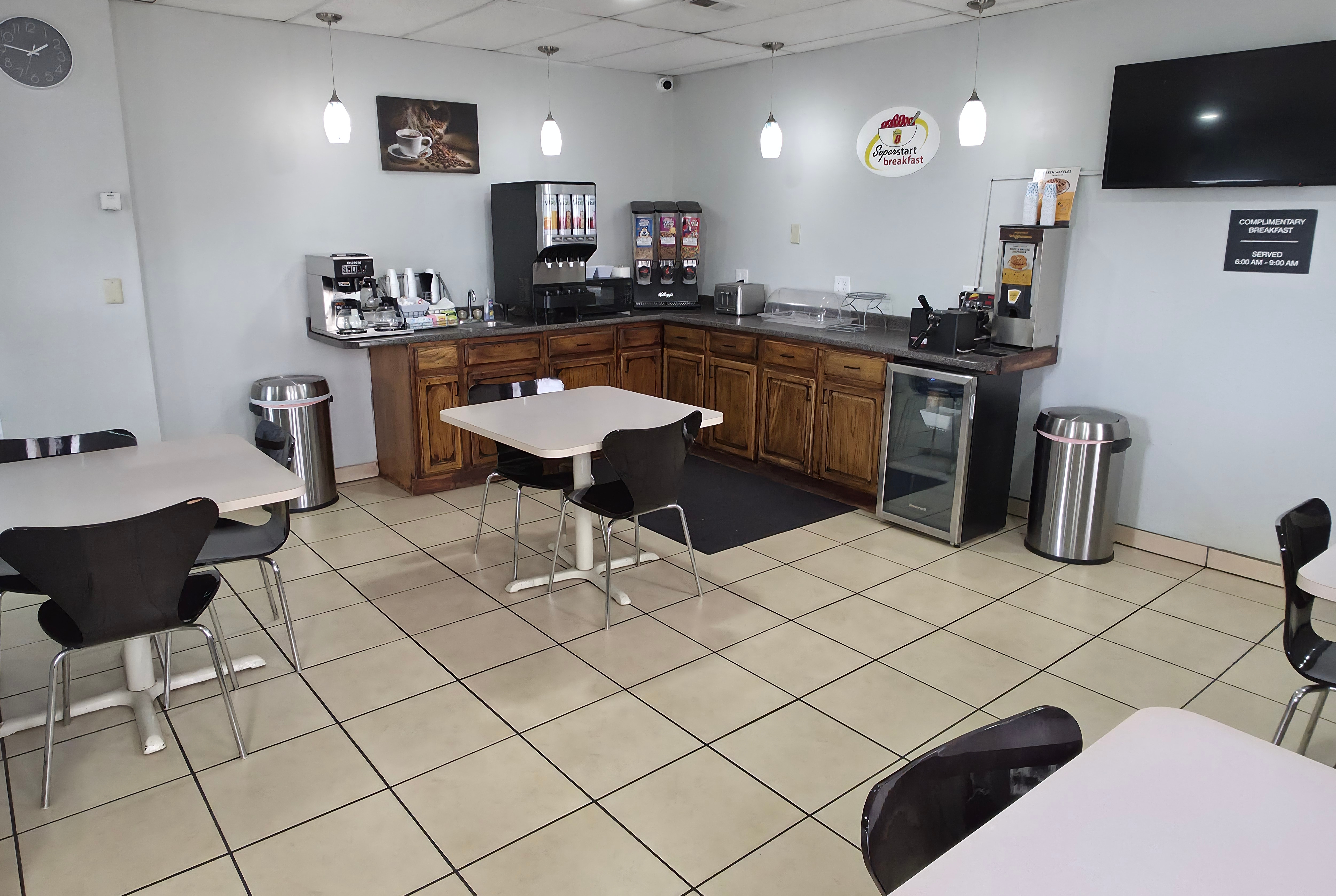 Super 8 by Wyndham Yankton restaurant breakfast area with seating in Yankton, South Dakota