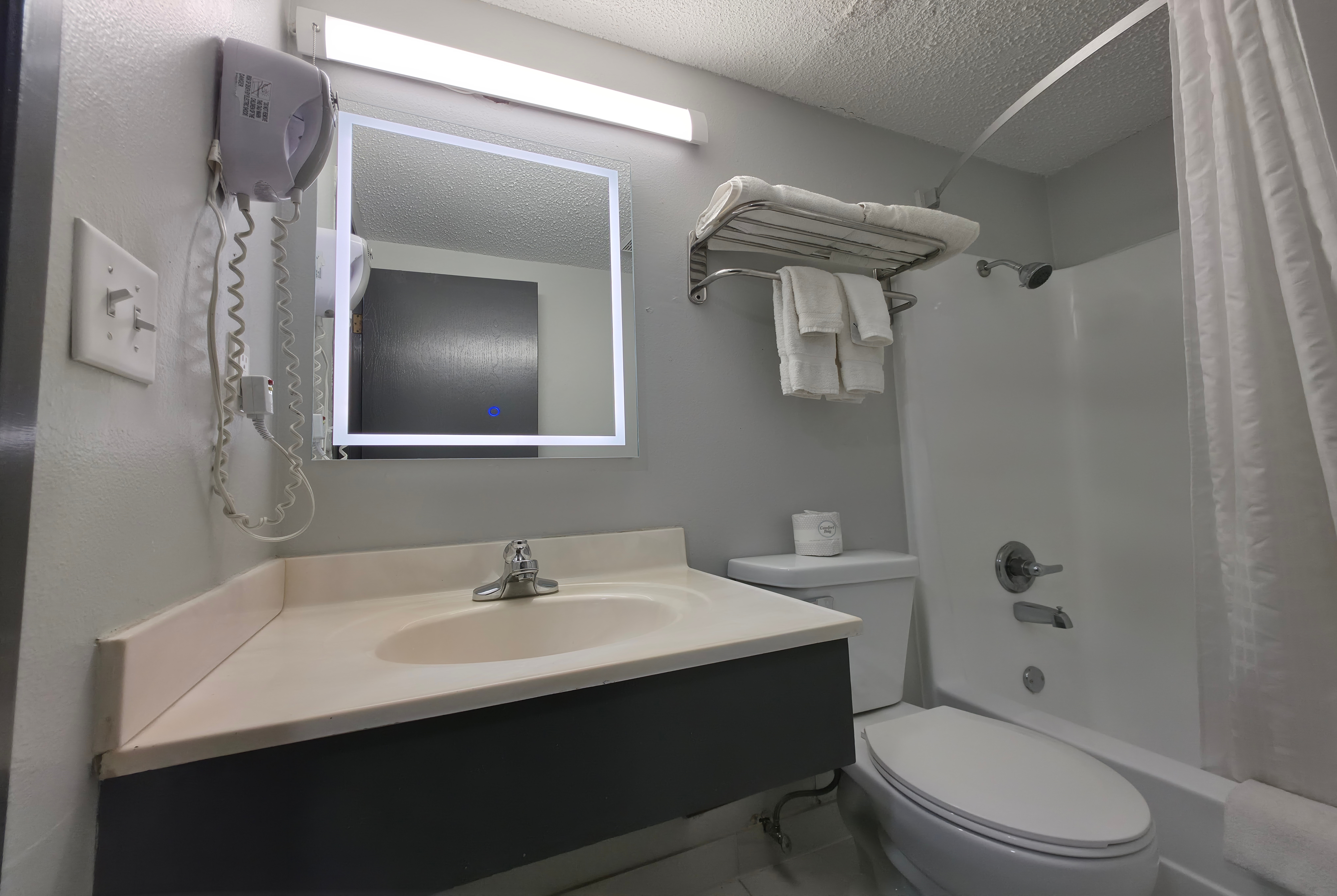 Guest room bath at the Super 8 by Wyndham Yankton in Yankton, South Dakota