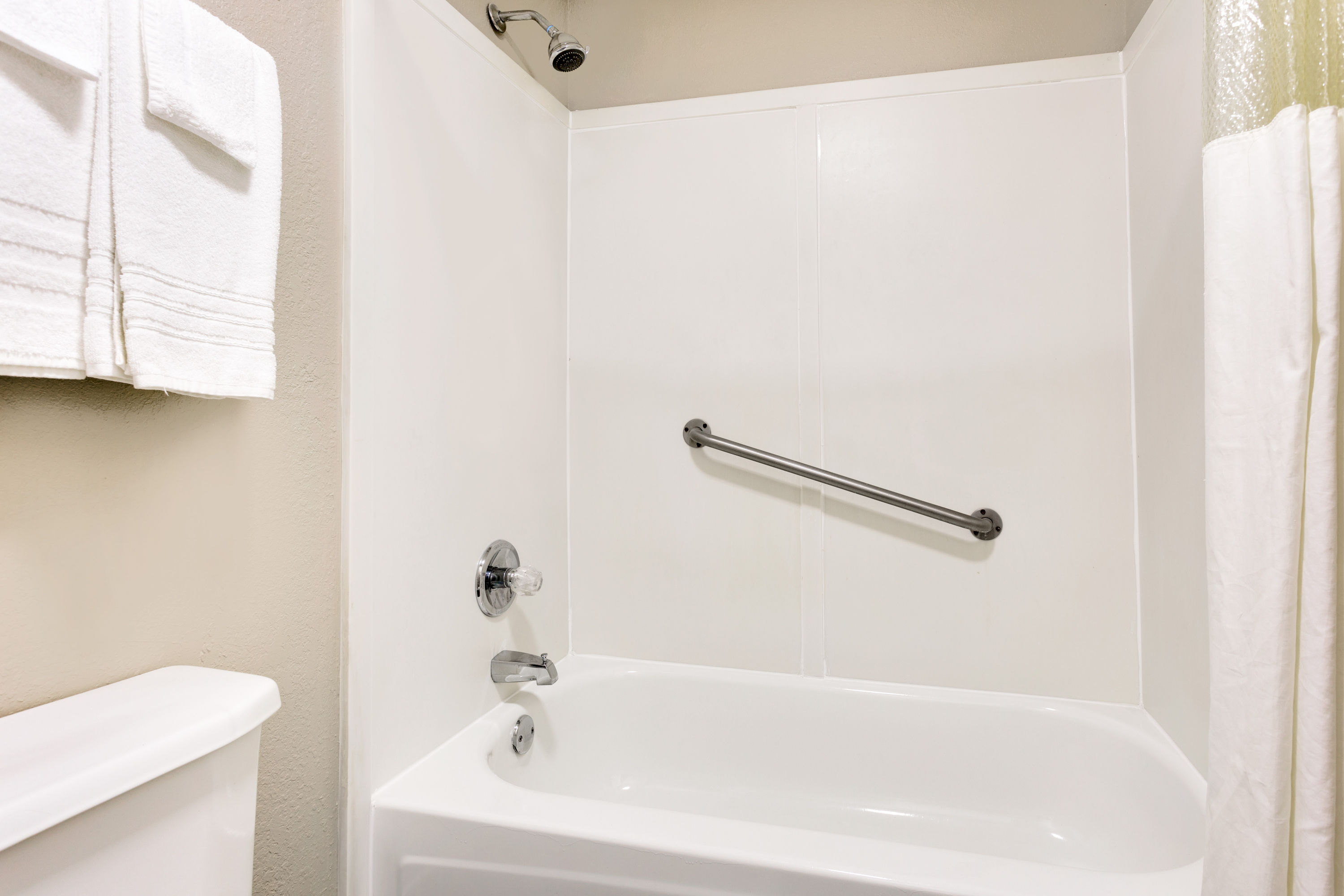 Guest room bath at the Super 8 by Wyndham Athens in Athens, Tennessee