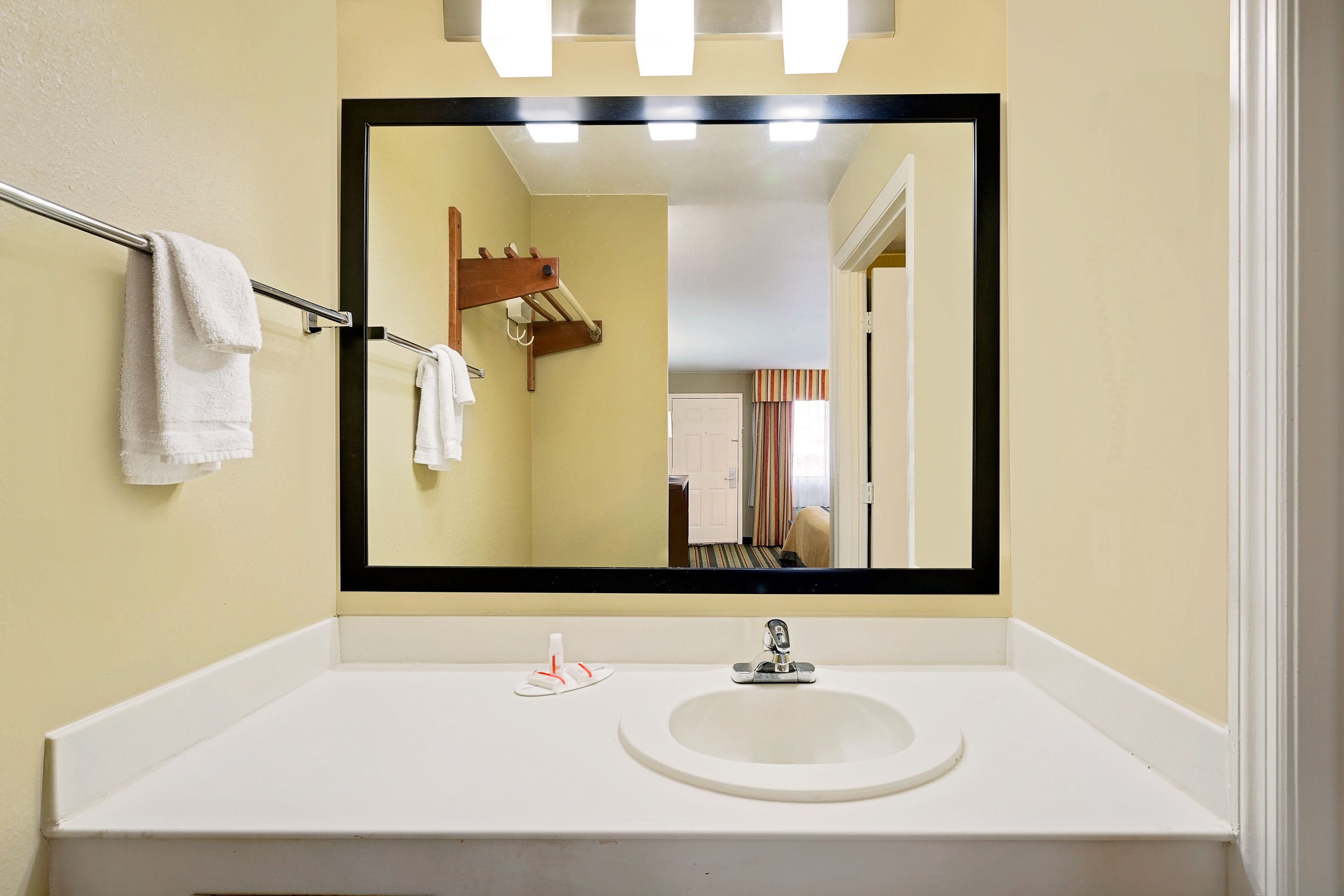 Guest room bath at the Super 8 by Wyndham Hermitage Nashville in Hermitage, Tennessee