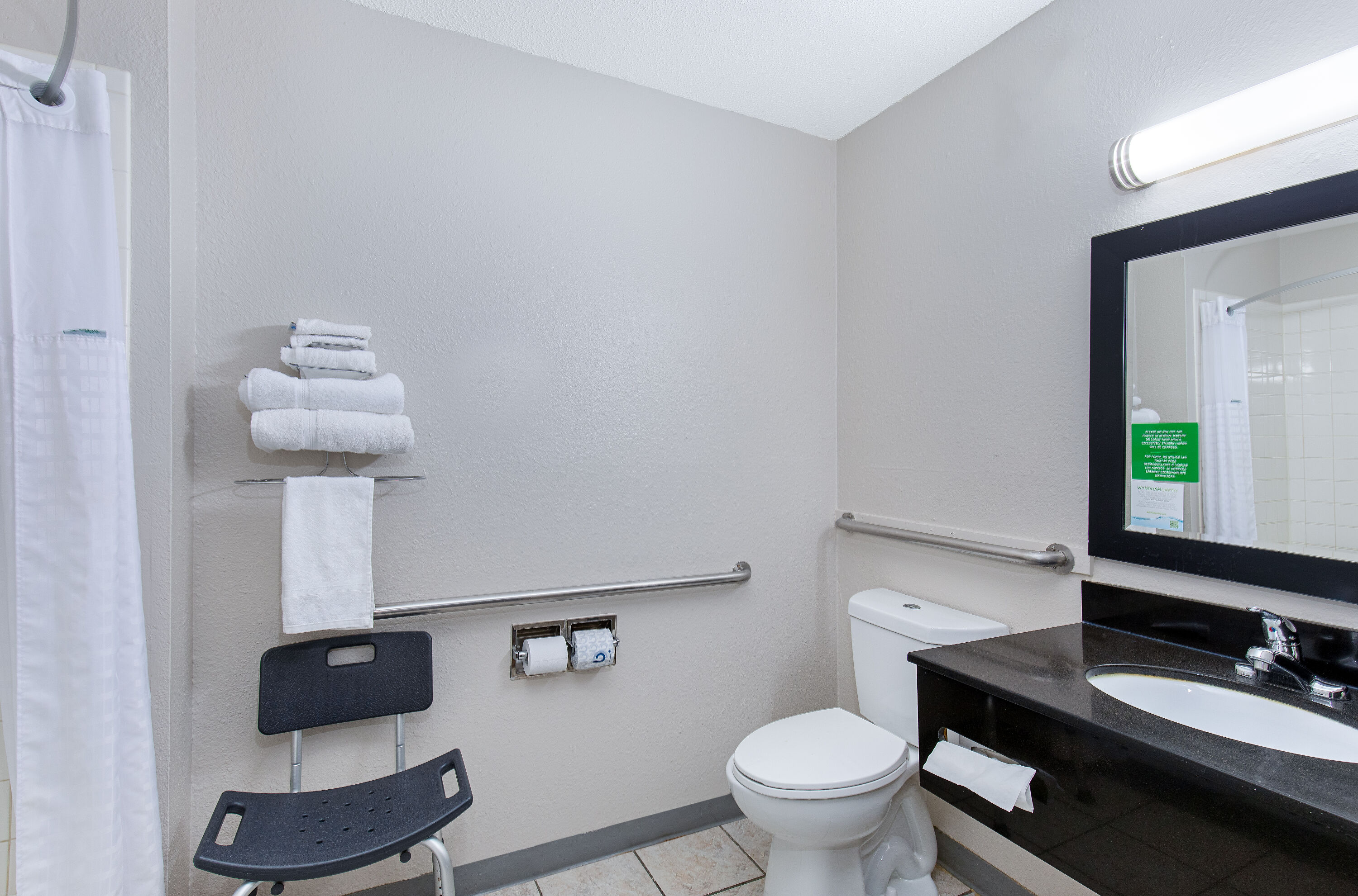 Guest room bath at the Super 8 by Wyndham Johnson City in Johnson City, Tennessee