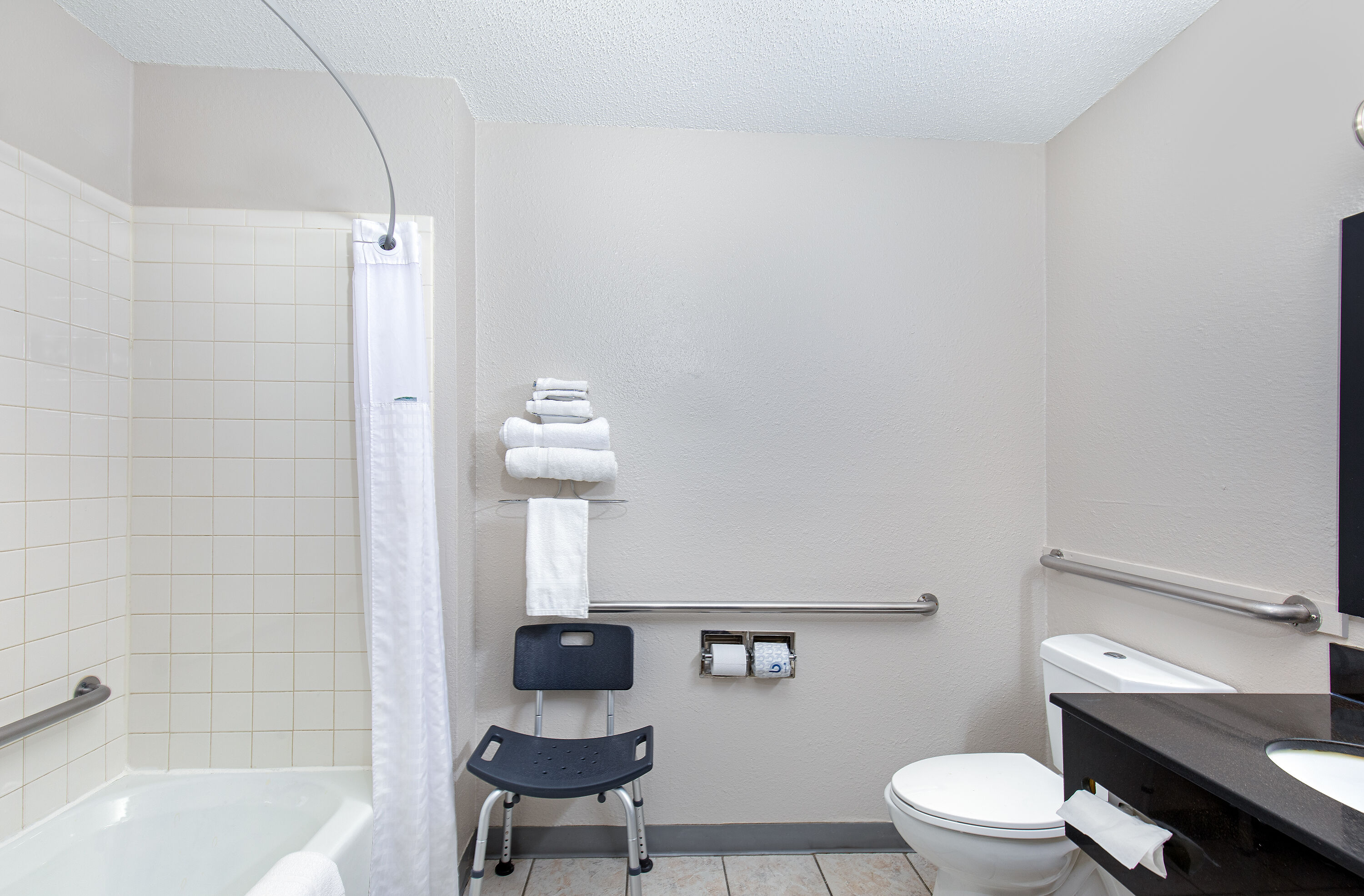 Guest room bath at the Super 8 by Wyndham Johnson City in Johnson City, Tennessee