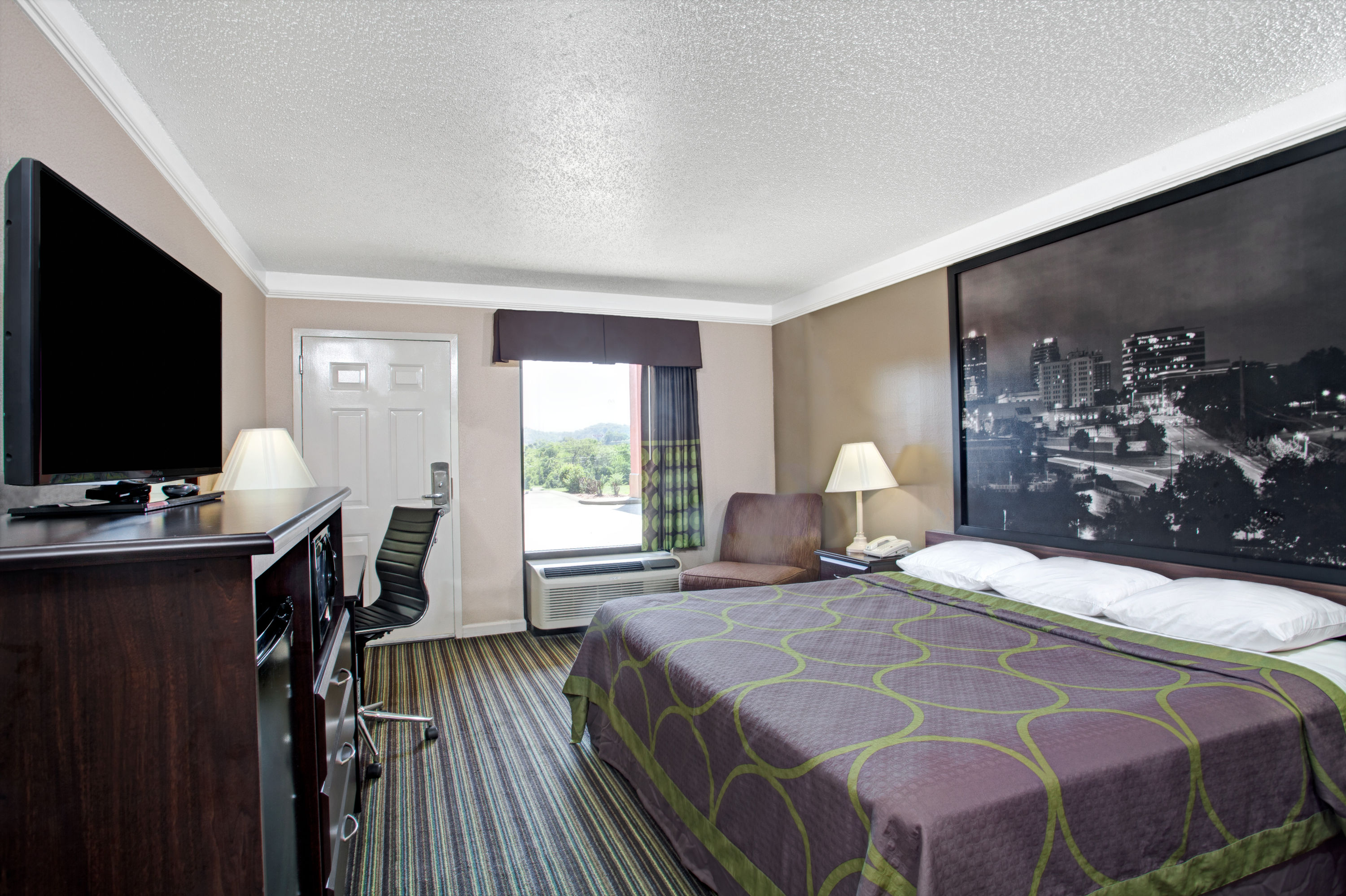Guest room at the Super 8 by Wyndham Knoxville East in Knoxville, Tennessee