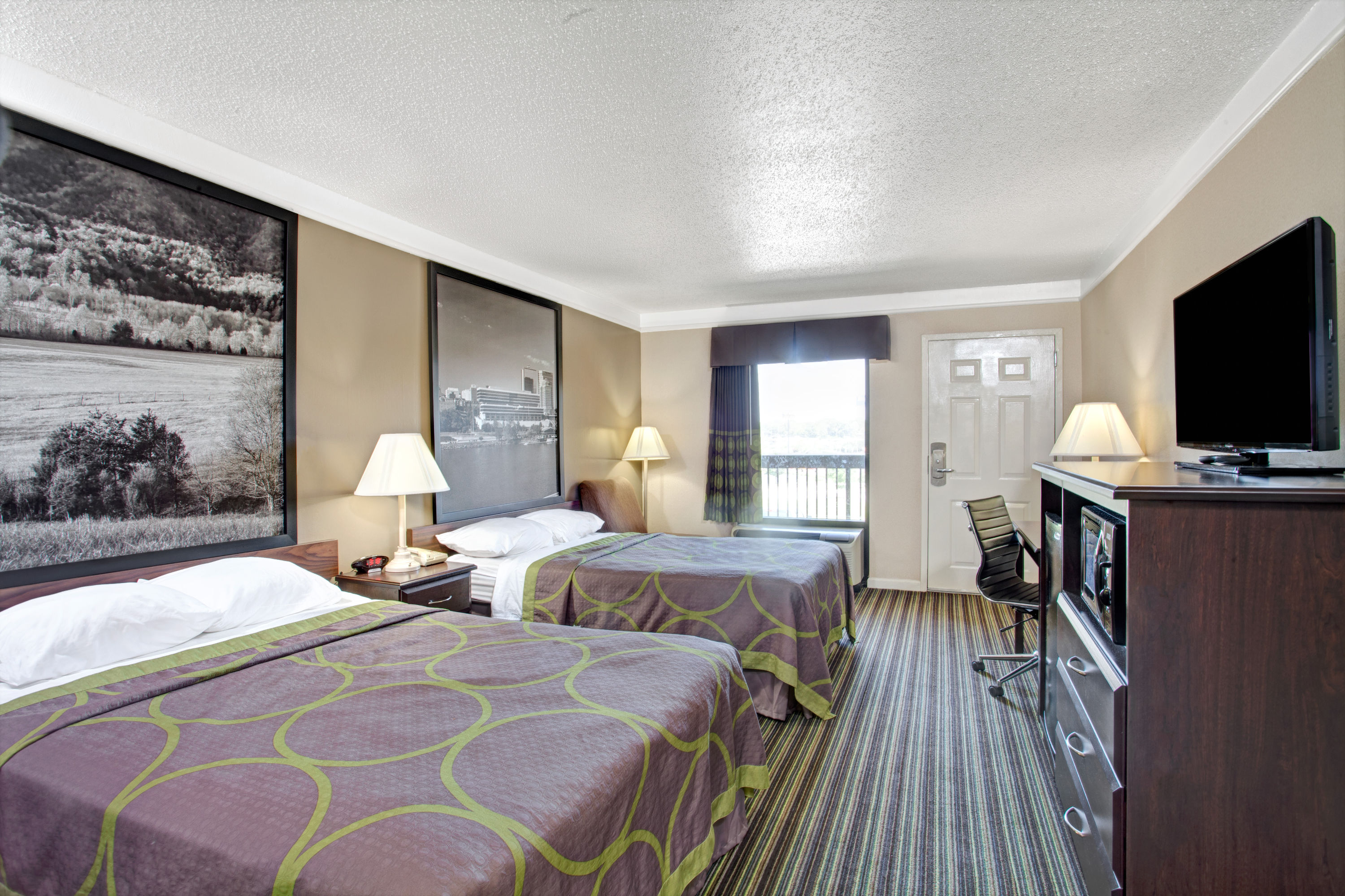 Guest room at the Super 8 by Wyndham Knoxville East in Knoxville, Tennessee