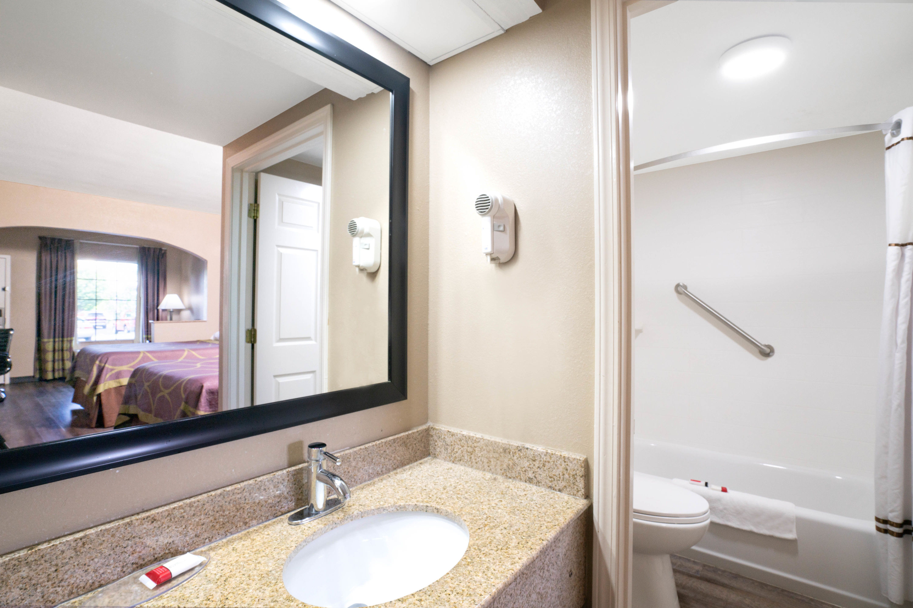 Guest room bath at the Super 8 by Wyndham Murfreesboro in Murfreesboro, Tennessee