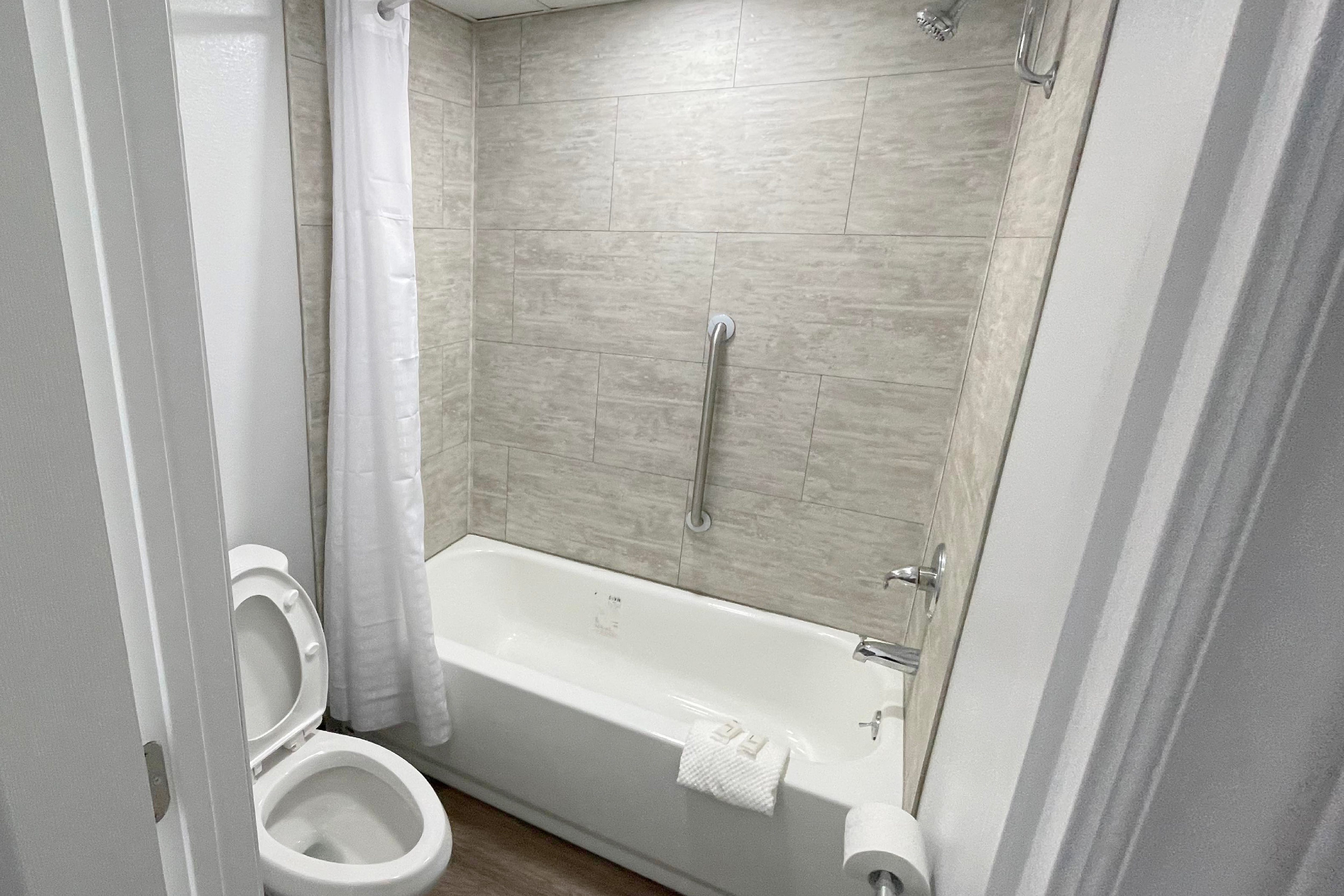 Guest room bath at the Super 8 by Wyndham Pigeon Forge Downtown in Pigeon Forge, Tennessee