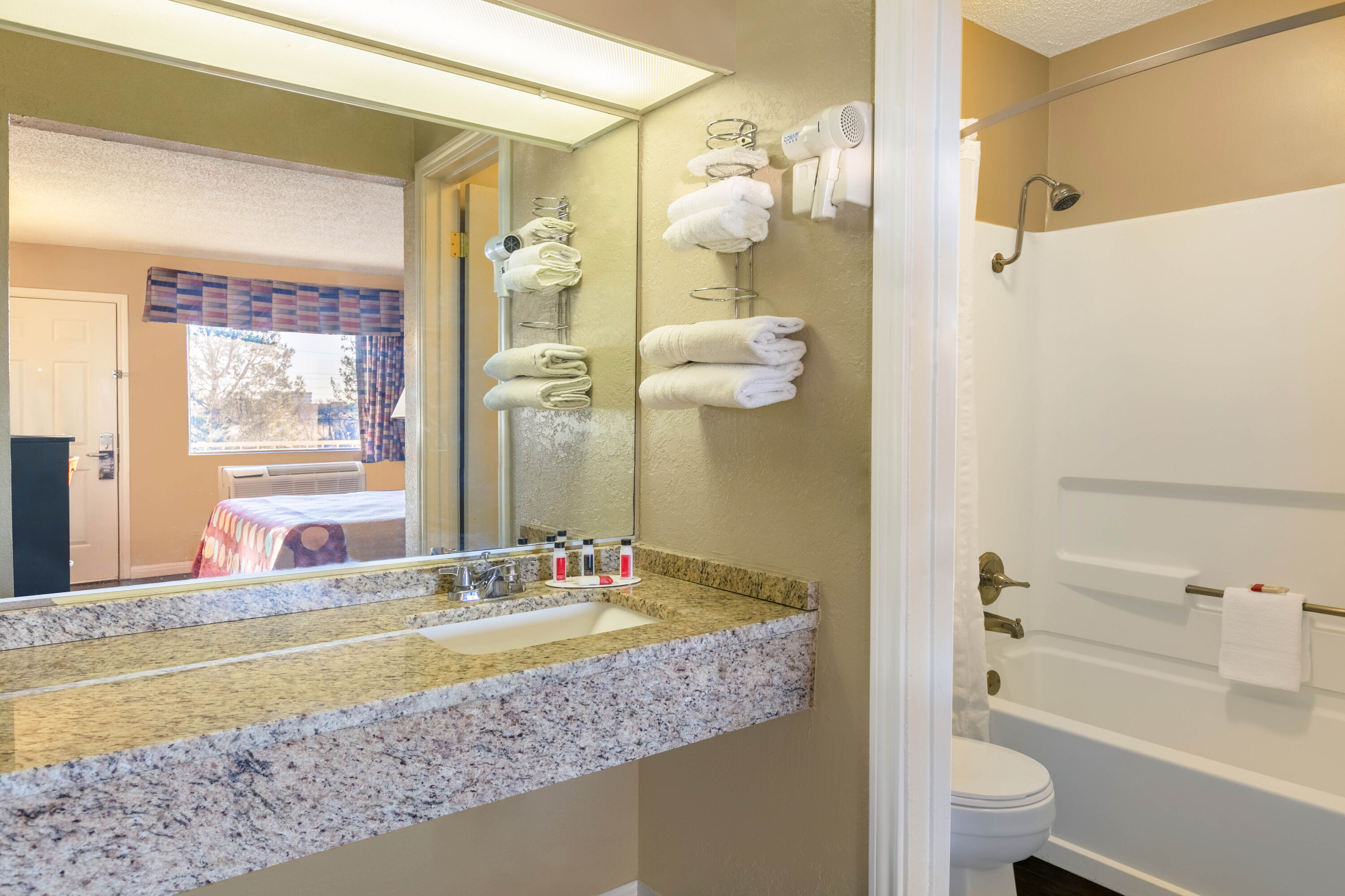 Guest room bath at the Super 8 by Wyndham Abilene North in Abilene, Texas