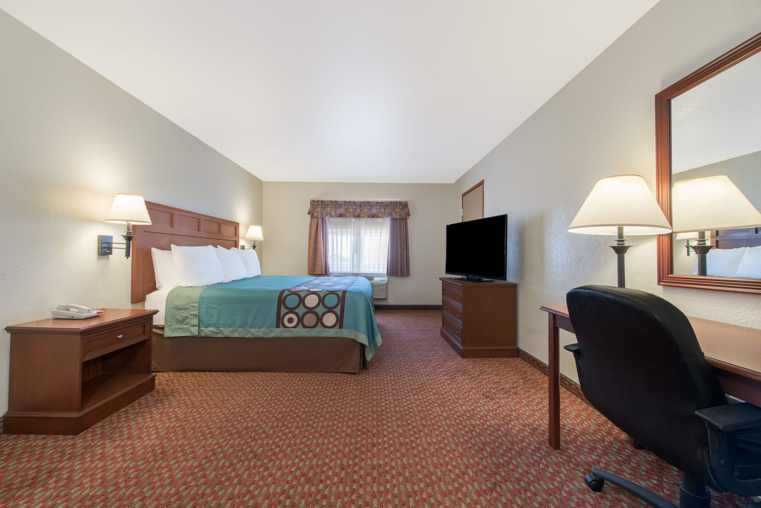 Guest room at the Super 8 by Wyndham Abilene South in Abilene, Texas