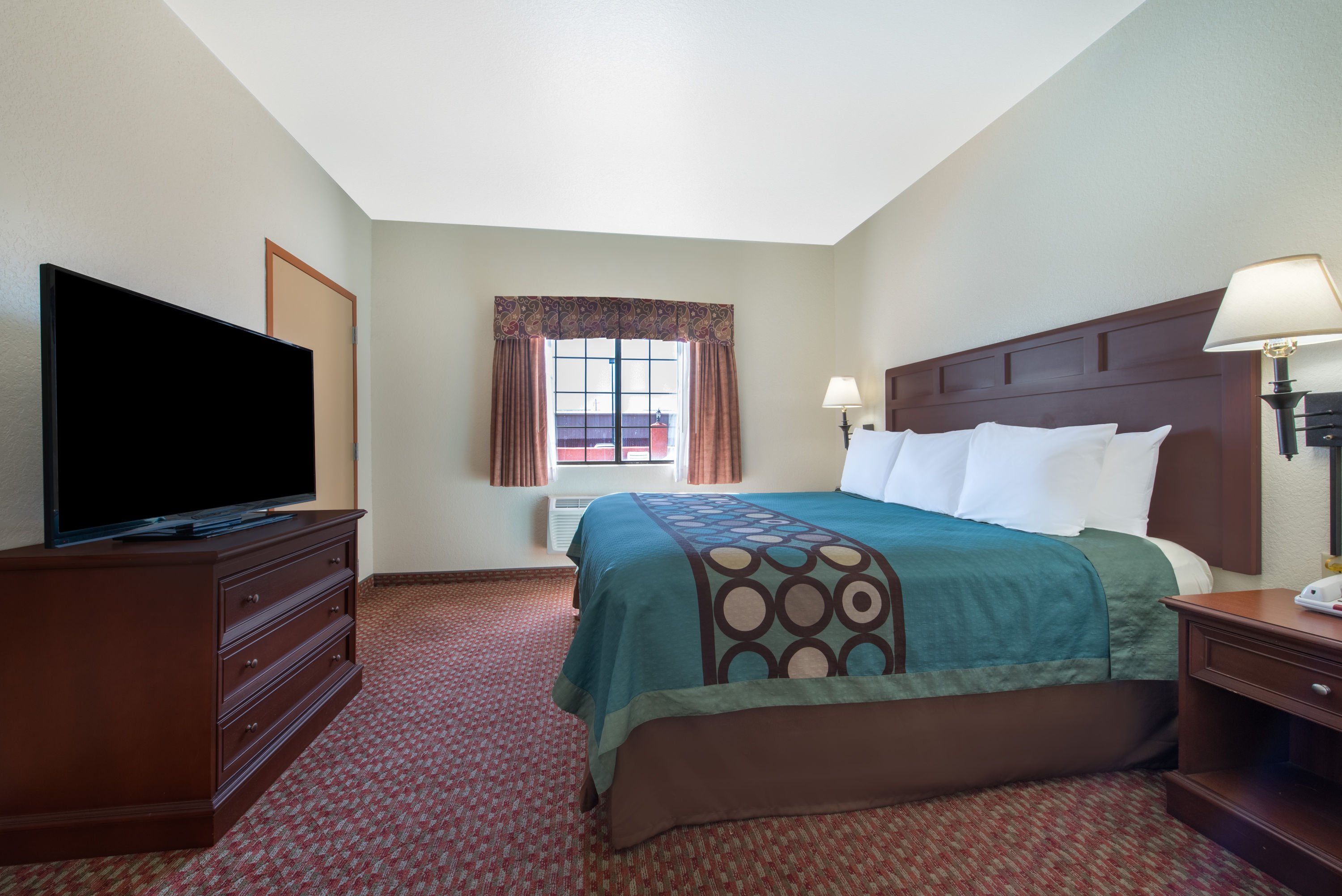 Guest room at the Super 8 by Wyndham Abilene South in Abilene, Texas