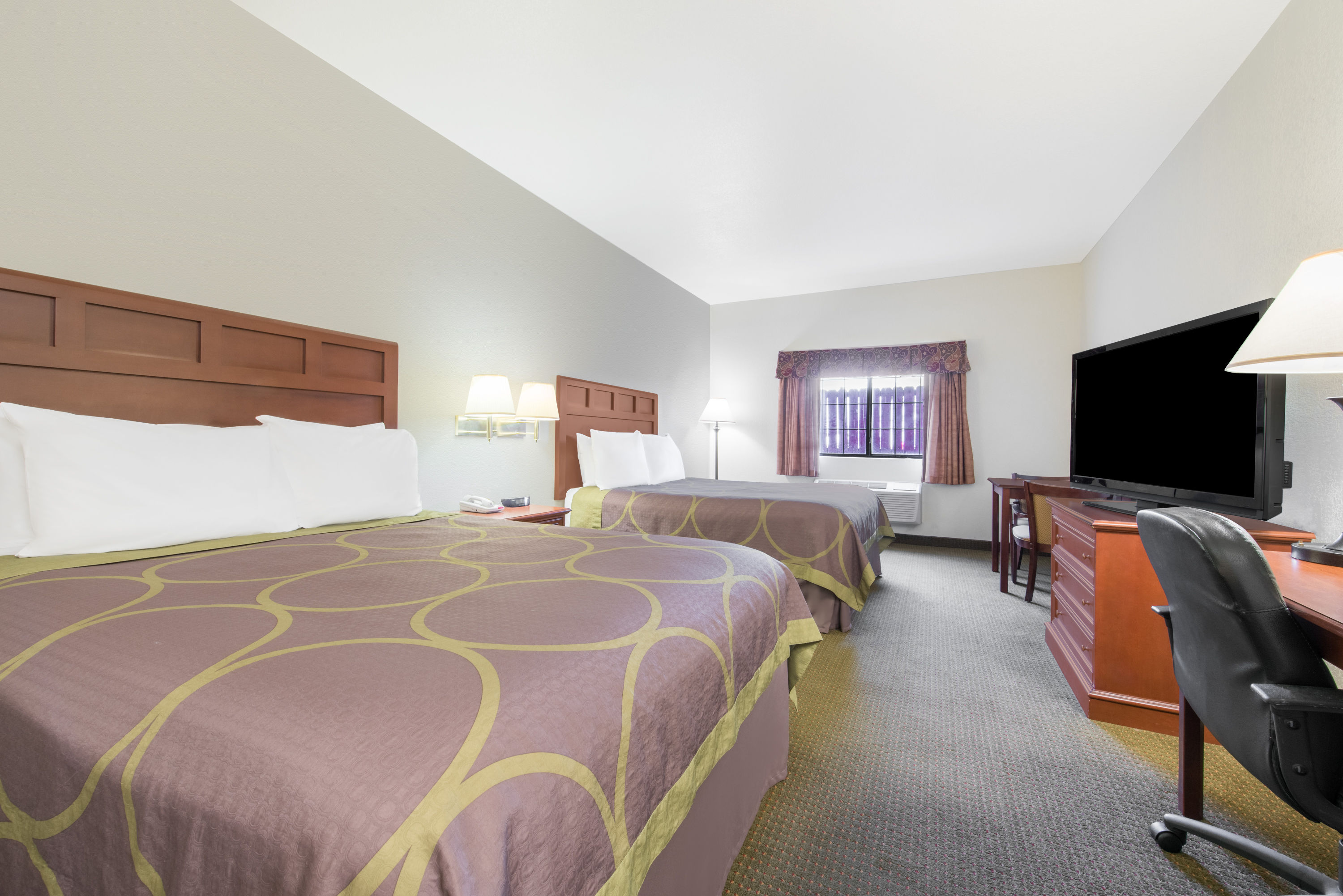 Guest room at the Super 8 by Wyndham Abilene South in Abilene, Texas