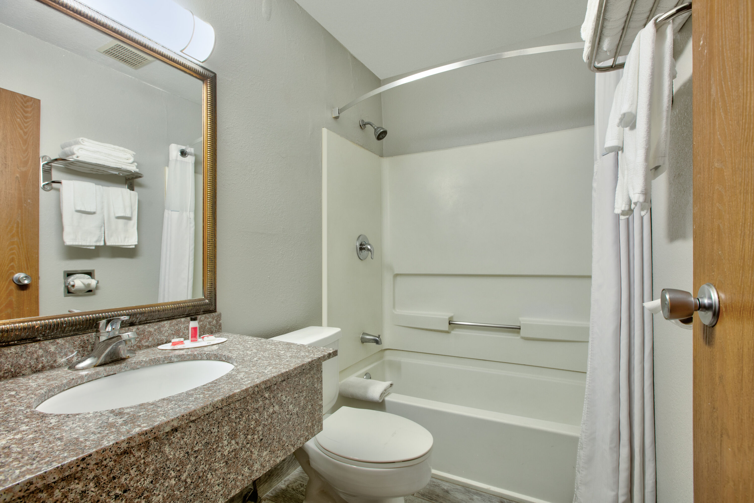 Guest room bath at the Super 8 by Wyndham Amarillo East in Amarillo, Texas