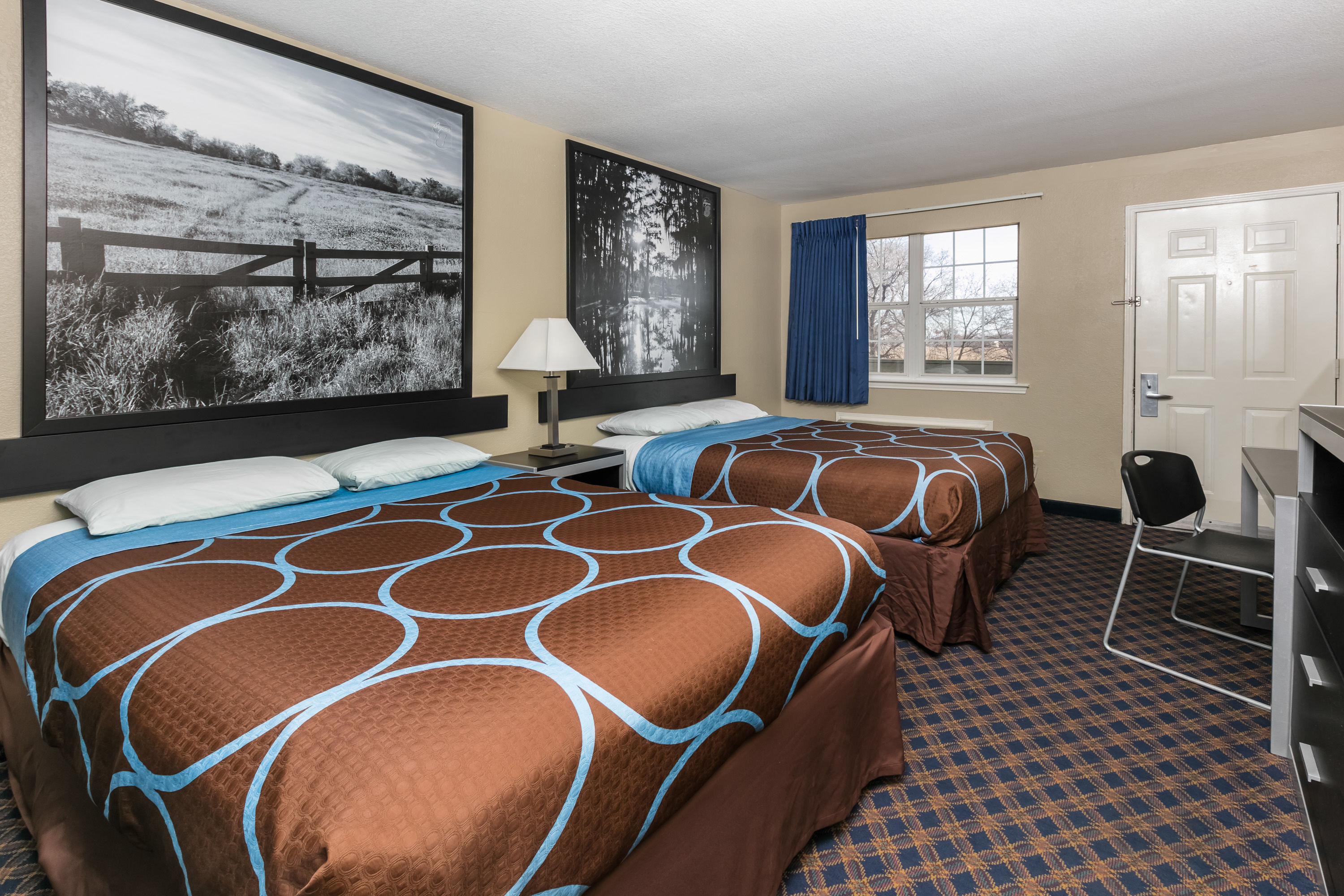 Guest room at the Super 8 by Wyndham Arlington Near AT&T Stadium in Arlington, Texas
