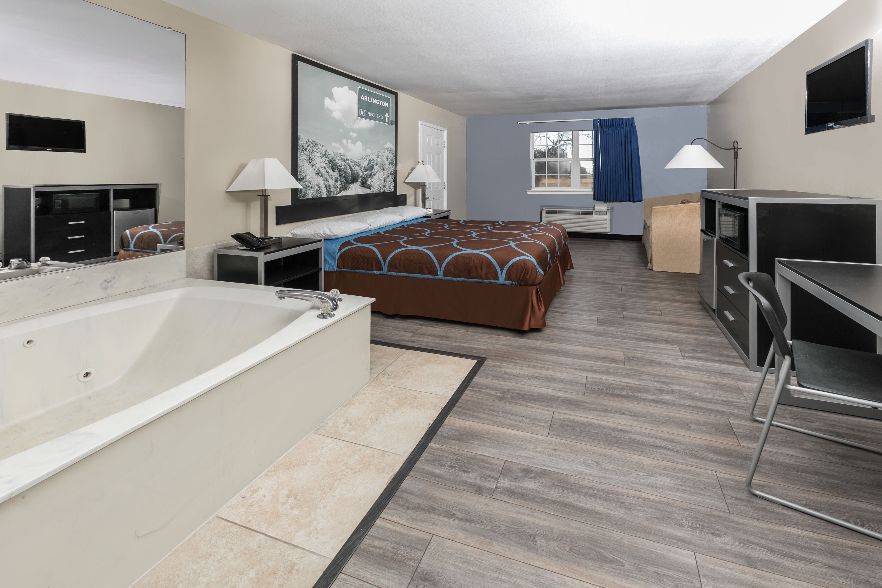 Guest room at the Super 8 by Wyndham Arlington Near AT&T Stadium in Arlington, Texas