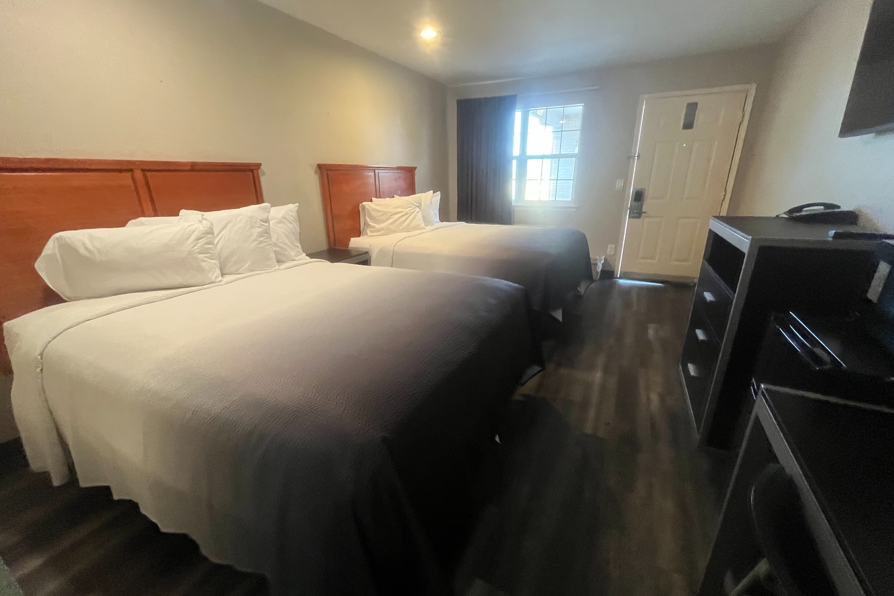 Guest room at the Super 8 by Wyndham Arlington Near AT&T Stadium in Arlington, Texas